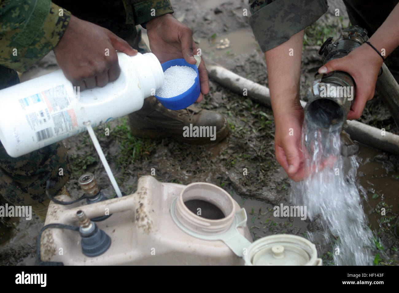 Chlorine crystals are added to water to create a waterpurification solution Feb. 20. The