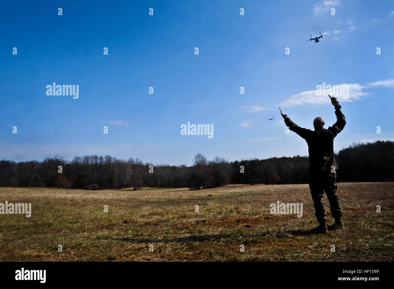 Capt. Joshua Rogerson, The Basic School air officer, signals MV22
