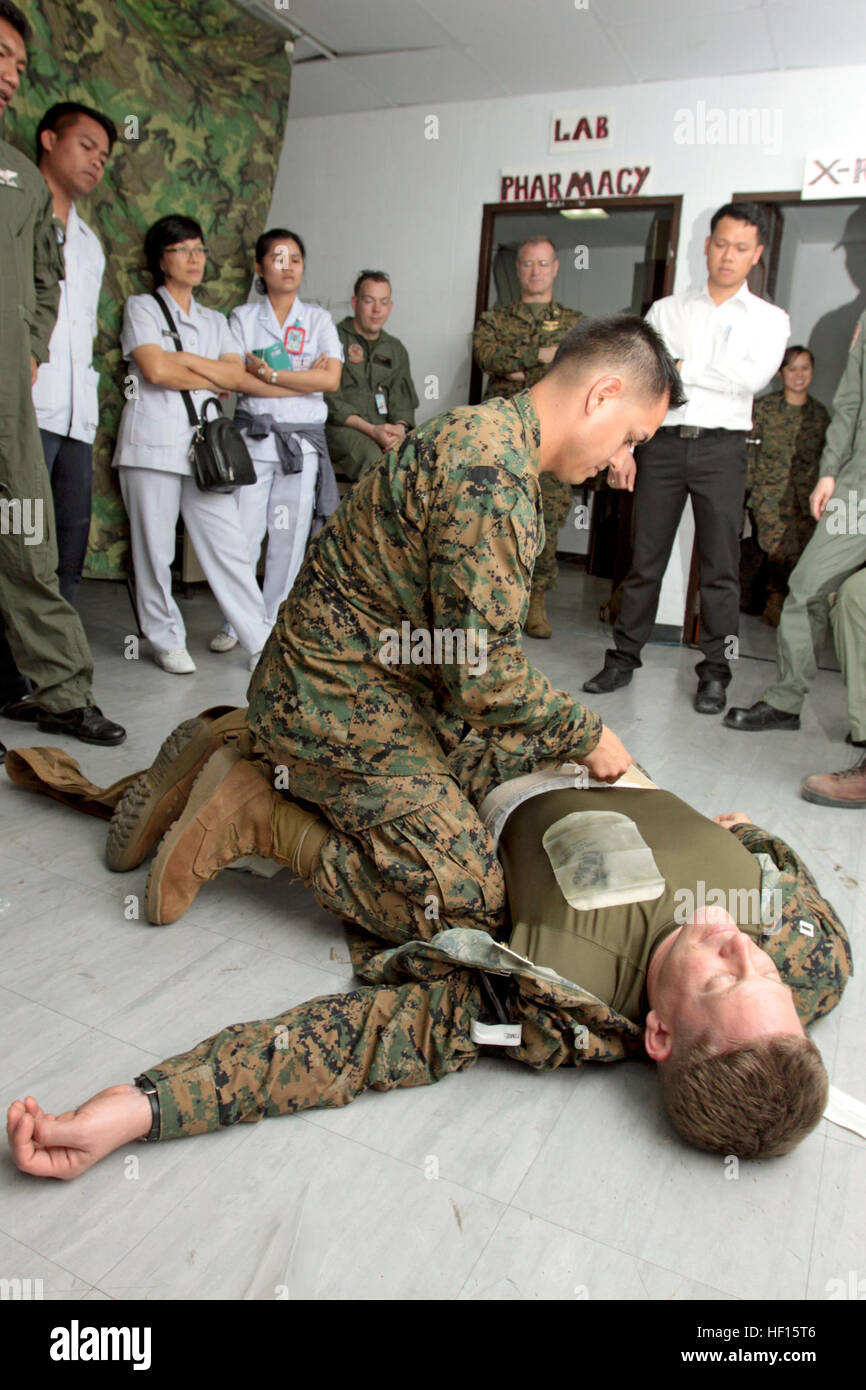 U.S. Navy Petty Officer 1st Class Joseph De La Cruz demonstrates