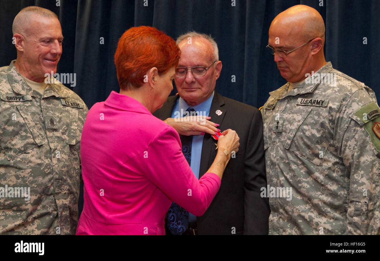 U.S. Army personnel witness a Bronze Star Medal presentation on March 5 ...