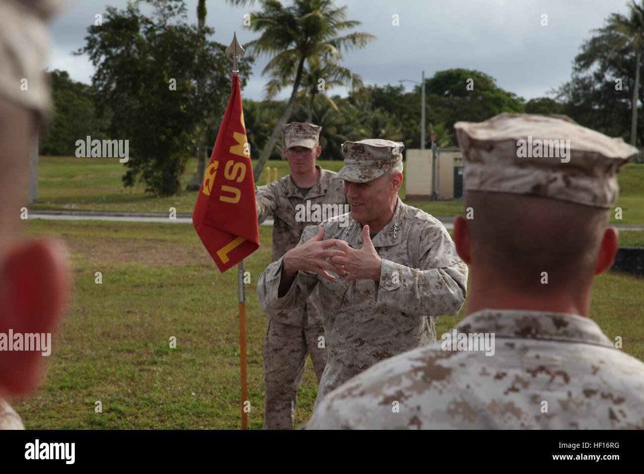 Gen. John M. Paxton Jr., Assistant Commandant of the Marine Corps, addresses Marines during Exercise Guahan Shield. Guahan Shield is an exercise designed to facilitate multiservice engagements, set conditions for bilateral and multilateral training opportunities, and support rapid response to potential theater crises and contingency operations in the Asia-Pacific region. Paxton is visiting several sites, bases and stations as he travels throughout the region. Paxton took over as the Assistant Commandant of the Marine Corps on December 15, 2012 and serves as the deputy, and second highest-ranki Stock Photo