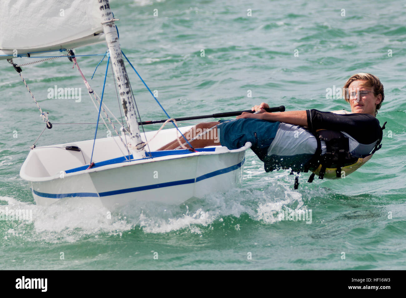 A 15-year-old sailor competes in the Hawaii Youth Sailing Association ...