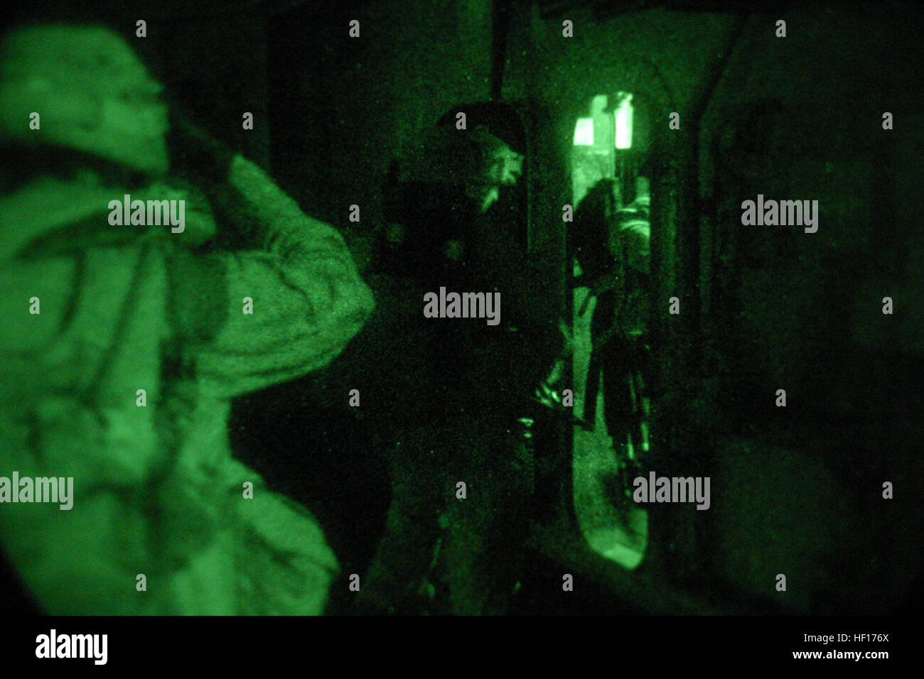 ABOARD USS BOXER (Aug. 12, 2006) -- Marines with Mortar's Platoon, Weapon's Co., Battalion Landing Team 2/4, walk through a hatch after completing a helicopter Tactical Recovery of Aircraft Personnel exercise . BLT 2/4 is participating for Joint Task Force Exercise in support of the 15th Marine Expeditionary Unit. JTFEX is the final evaluation for the MEU, in which their capabilities as a Marine Air Ground Task Force are tested. (Official USMC photo by Cpl. Thomas J. Grove) (Released) USMC-060812-M-5578G-053 Stock Photo