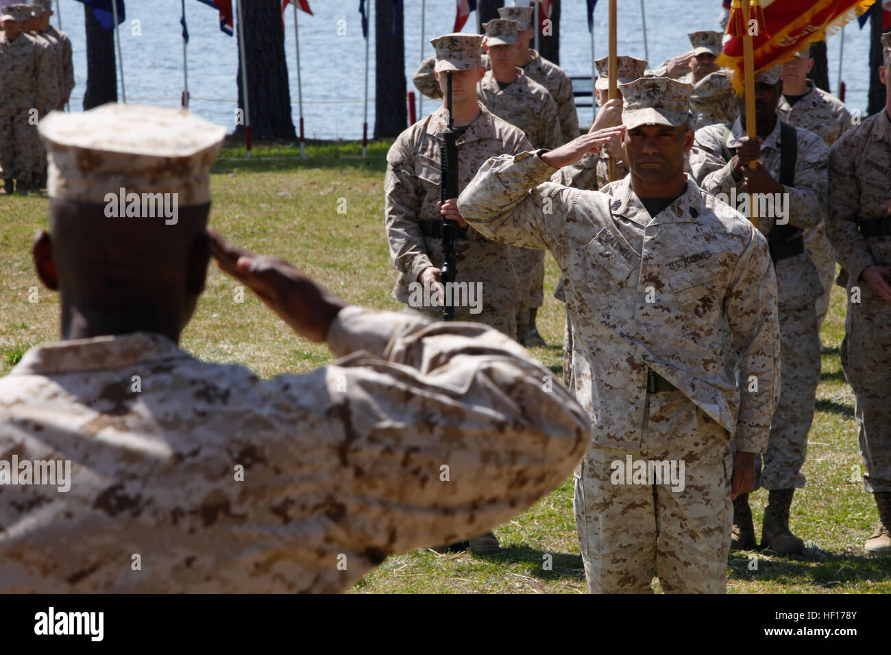 U. S. Marine Gunnery Sergeant Markus Caldwell (right), Instructor, Motor Transportation Maintenance Instructional Company (MTMIC), Logistics Operations School (LOS), Marine Corps Combat Service Support Schools (MCCSSS), renders a hand slaute to Major Jerry Godfrey (Left), Commanding Officer, MTMIC, LOS, MCCSSS, during his retirement ceremony on Camp Johnson N.C., March 28, 2013. Friends, family, and service members gathered to celebrate Gunnery Sergeant Caldwell for his 22 years of faithful service to the United States Marine Corps. (U.S. Marine Corps photo by Sergeant Mark E. Morrow Jr/Releas Stock Photo