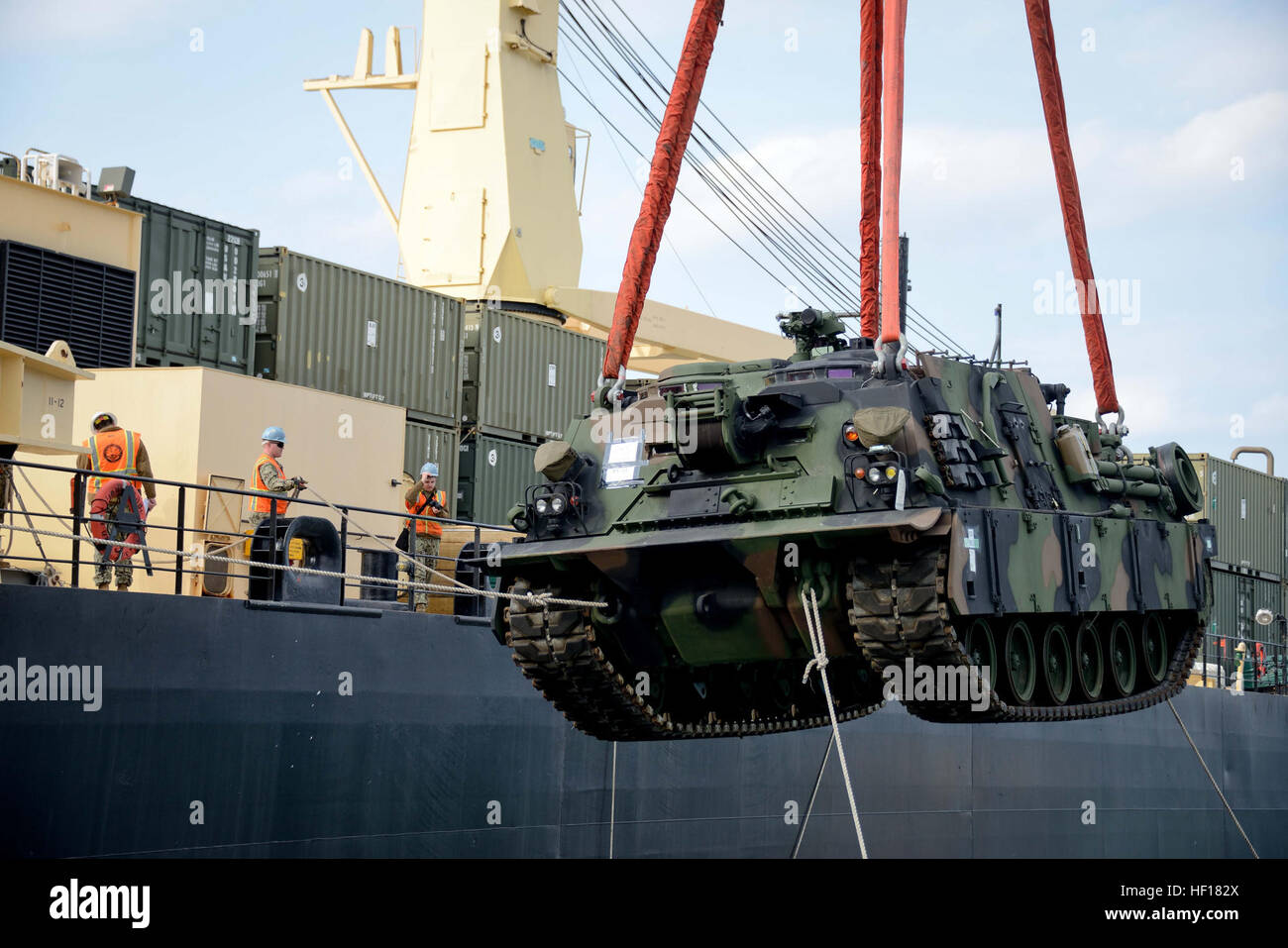 An M88 tank recovery vehicle is lowered from the USNS 2nd LT John P. Bobo to the deck of a logistics support vessel April 19 off shore of Dogu Beach near Pohang, Republic of Korea, during Combined Joint Logistics Over The Shore 2013. The Bobo is part of the Navy's Military Sealift Command's maritime prepositioning force program. CJLOTS is a biennial MPF exercise. The ROK Marine Corps and Navy are scheduled to work with III Marine Expeditionary Force, Army forces with U.S. Forces Korea, Navy Expeditionary Strike Group 3, and Coast Guard Port Security Unit 313 during the exercise. (U.S. Marine C Stock Photo