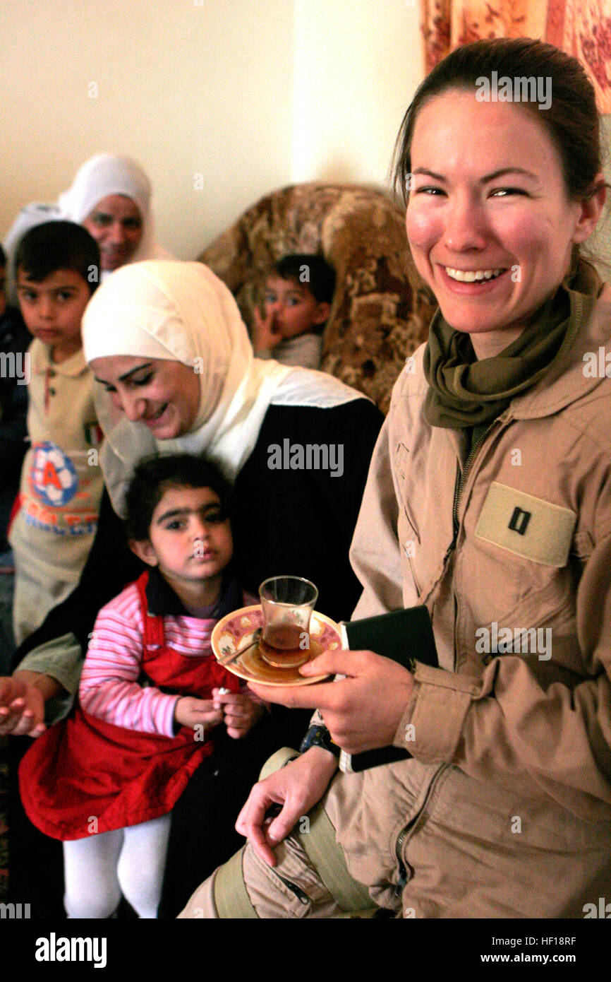 061128-M-8213R-019 Baghdadi, Al Anbar, Iraq (Nov. 28, 2006) - U.S. Navy Lt. Bundy-Ladowicz, assigned to 3rd Marine Aircraft Wing Forward (3rd MAW (FWD)), enjoys chie (tea) and bread during an Iraqi Woman's Engagement regarding issues and concerns they have in their community. 3rd MAW (FWD) is deployed with 1st Marine Expeditionary Force (FWD) in support of the global war on terrorism in the Al Anbar Province of Iraq. U.S. Marine Corps photo by Gunnery Sgt. Michael Q. Retana (RELEASED) US Navy 061128-M-8213R-019 U.S. Navy Lt. Bundy-Ladowicz, assigned to 3rd Marine Aircraft Wing Forward (3rd MAW Stock Photo