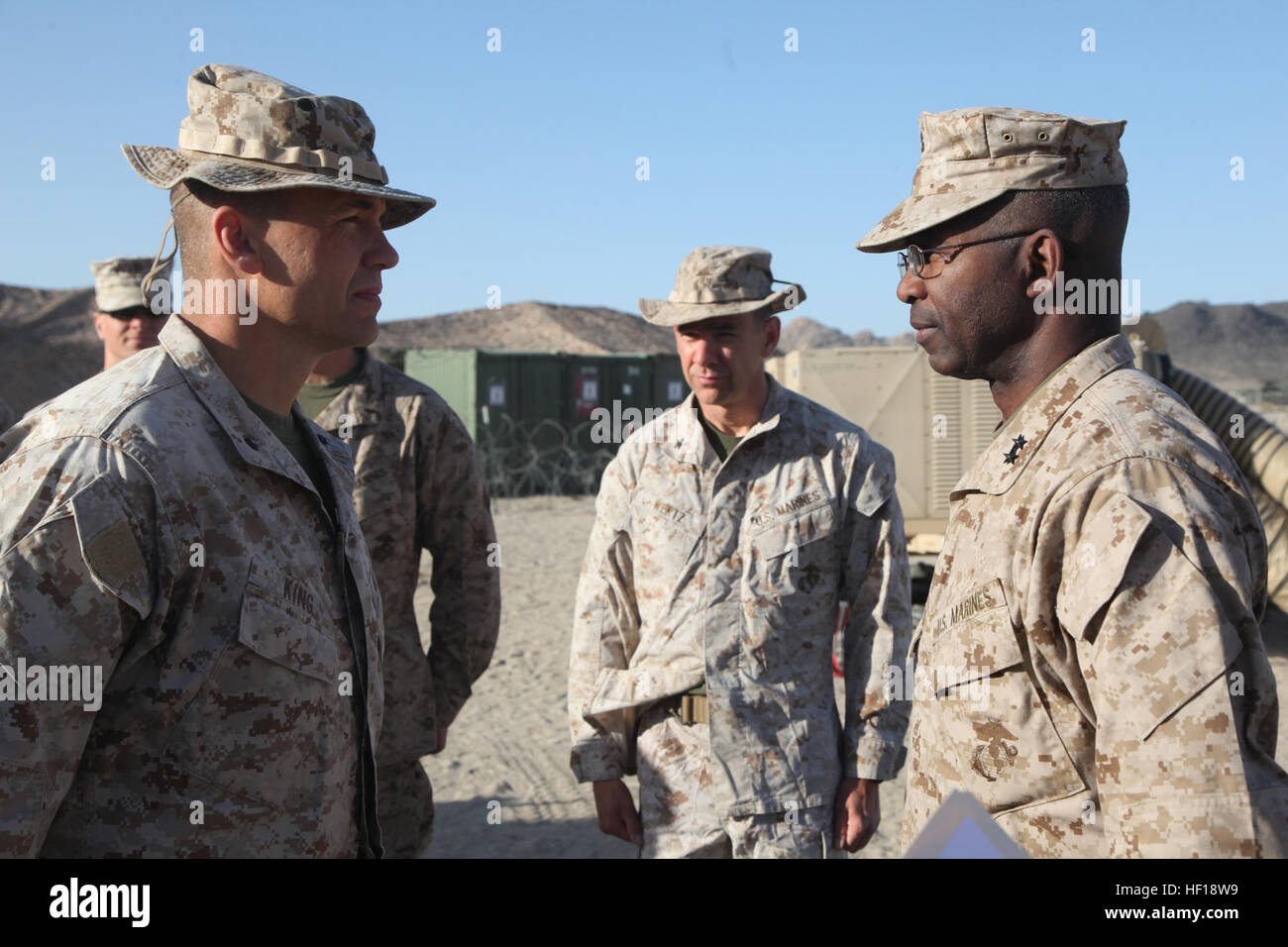 U.S. Marine Corps Lt. Col James King, left, senior watch officer, 1st Marine Division (1ST MARDIV), stands before Maj. Gen. Ronald L. Bailey, commanding general, 1ST MARDIV at his promotion ceremony during Exercise DESERT SCIMITAR aboard Marine Corps Air Ground Combat Center Twentynine Palms, Calif., May 1, 2013. Bailey took the opportunity to promote King as he conducted a battlefield circulation during the division exercise. (U.S. Marine Corps Photo by Lance Cpl. Ismael E. Ortega, 1st Marine Division Combat Camera / Released) DESERT SCIMITAR 130501-M-RD023-023 Stock Photo