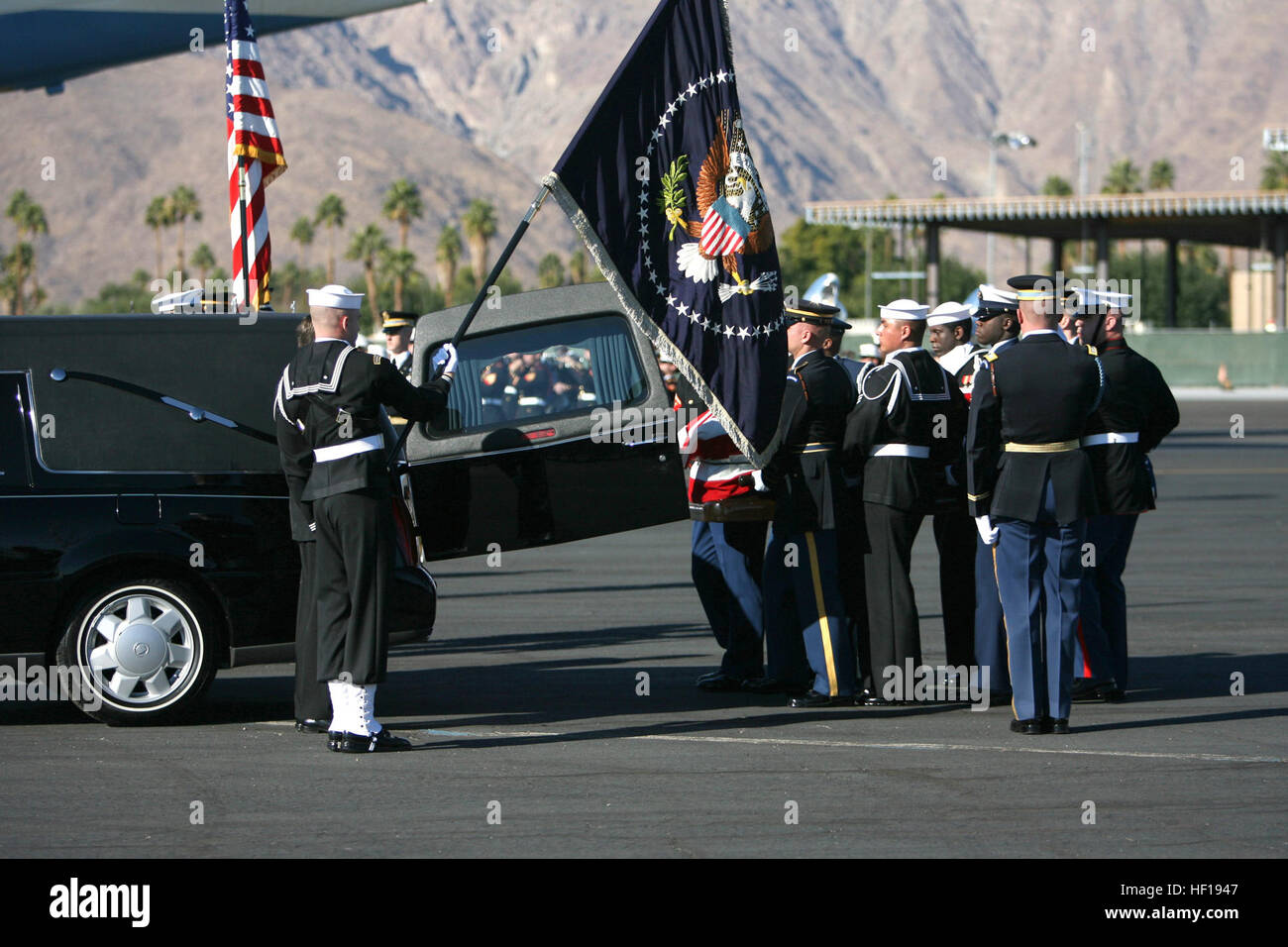 061230-M-3913K-010 Palm Springs, Calif. (Dec. 30, 2006) Ð Military personnel assigned to the Armed Forces Honor Guard transport the flag-draped casket of former President Gerald R. Ford to awaiting Presidential aircraft during his departure ceremony at the Palm Springs International Airport in Palm Springs, Calif., Dec. 30, 2006. DoD personnel are helping to honor Ford, the 38th president of the United States, who passed away on Dec. 26th. Ford's remains were flown to Washington, D.C., for a state funeral in the Capitol Rotunda and a funeral service at the Washington National Cathedral, follow Stock Photo