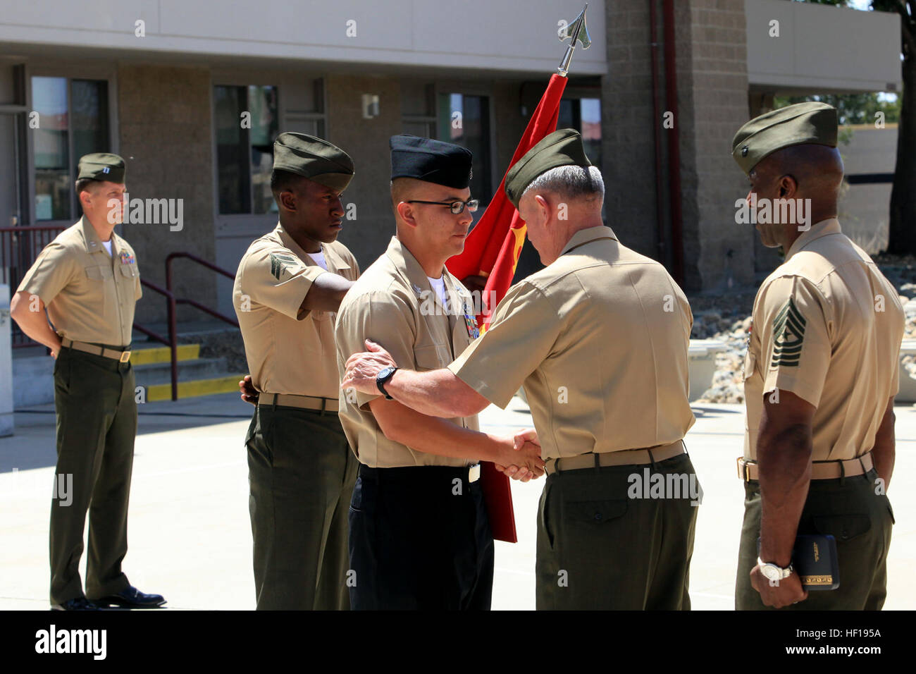 Maj. Gen. Charles M. Gurganus, commanding general of I Marine Expeditionary Force (Forward), presents and congratulates Petty Officer 1st Class Benny Flores, a corpsman serving with Air Naval Gunfire Liaison Company, with the Silver Star during a ceremony at Camp Pendleton, May 3. Flores was recognized for his actions on April 28, 2012, while serving with Regional Command Southwest providing medical support on a mission to Zaranj, Nimroz province, Afghanistan. Guam native awarded Silver Star 130503-M-BZ222-001 Stock Photo