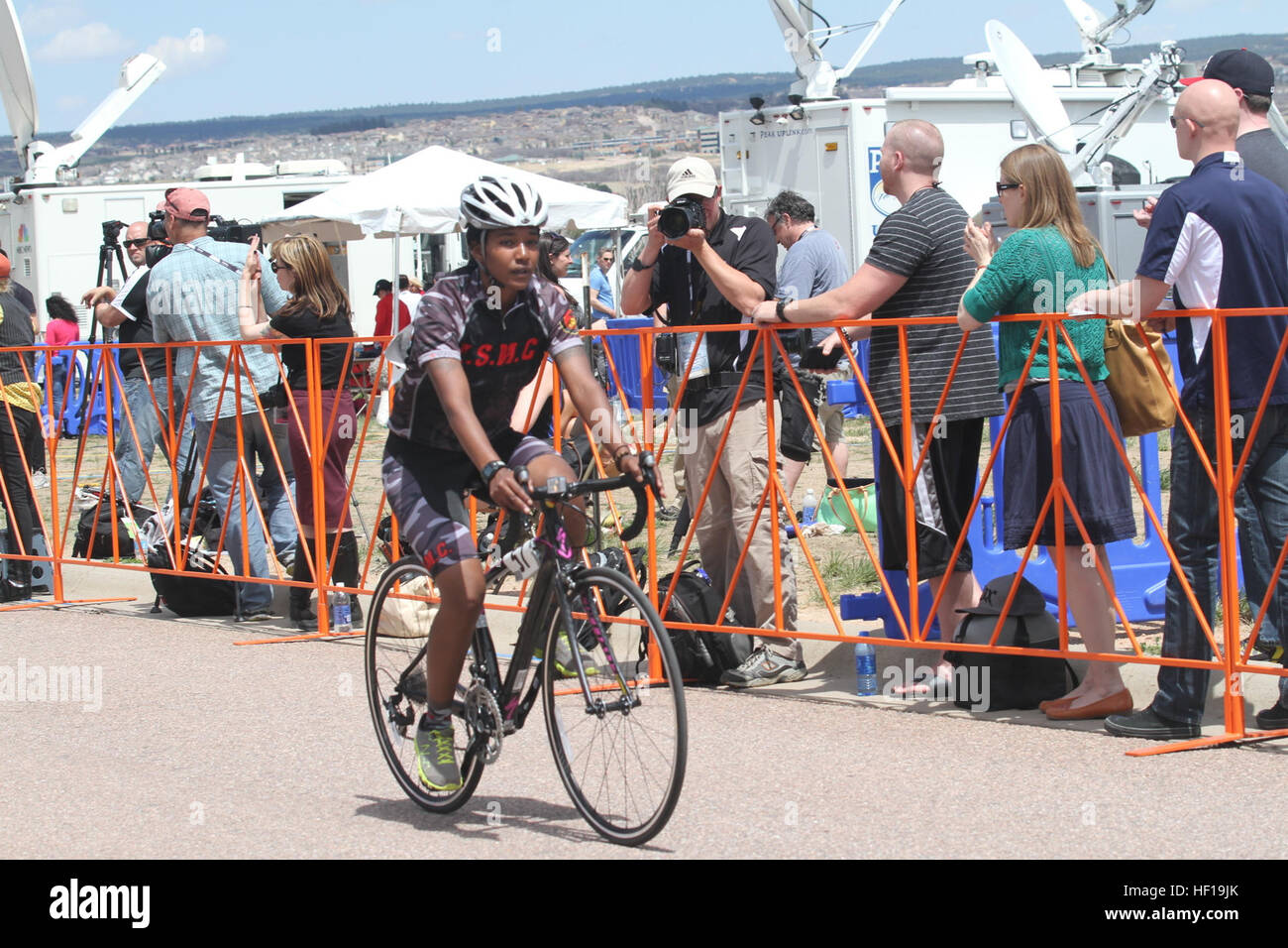 Cpl. Kidisti Averill, Wounded Warrior Battalion West, completes the women's 10k upright race during the 2013 Warrior Games at the Air Force Academy. Averill, 22, from Springs, N.Y., and her fellow Marines competed against fellow service members from other branches in the military. The team of 50 Marines and defending champions will compete in several events during the Games including wheelchair basketball, archery, cycling, shooting, sitting volleyball and track and field. They will defend their championship against the Army, Navy, Air Force, Coast Guard, Special Operations Command and the Bri Stock Photo