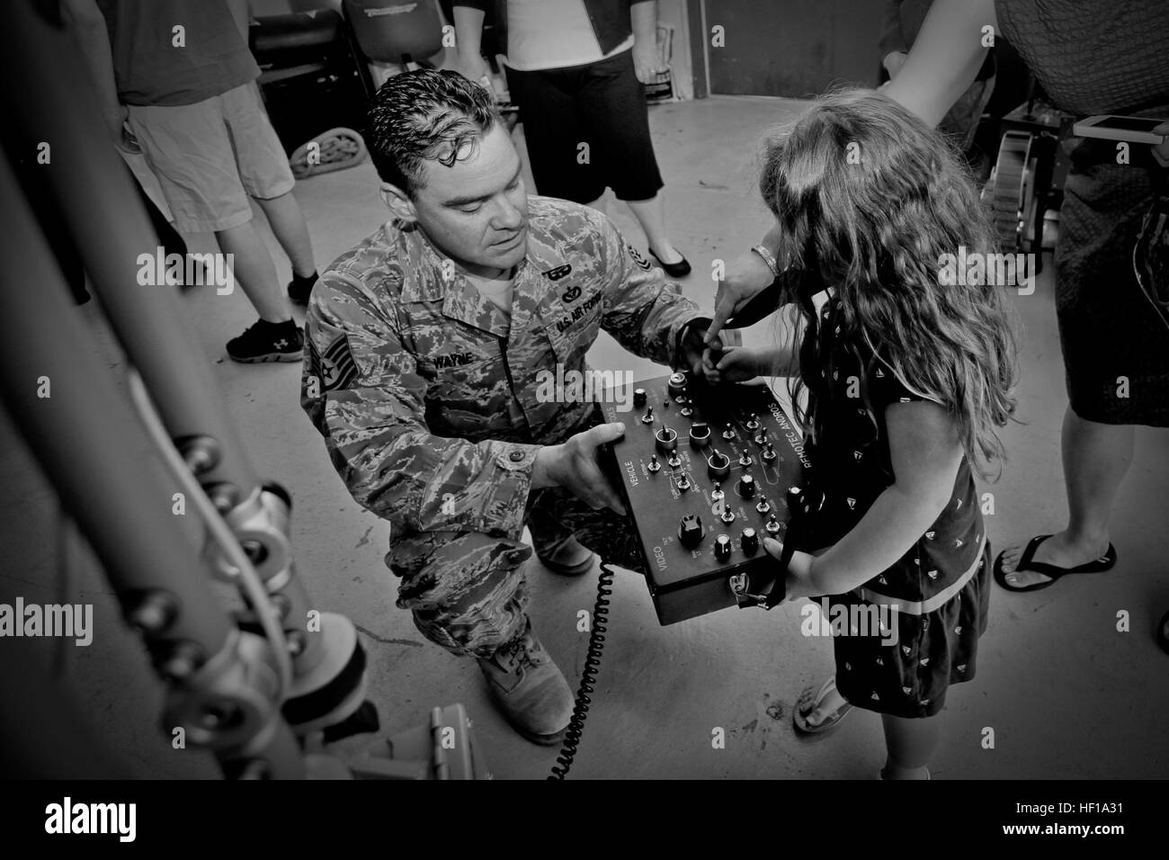 U.S. Air Force Tech. Sgt. Raymond Wayne shows family members of Tech. Sgt. John Hurley the F6A robot used by Explosive Ordinance Disposal (EOD) on May 18, 2013.  Wayne and Hurley are EOD techs assigned to the 177th Civil Engineering Squadron, 177th Fighter Wing, New Jersey Air National Guard.  Hurley was awarded the U.S. Army Commendation medal and Combat Action medal for his part in a fierce two hour battle in Ghazni Province, Afghanistan on Aug 15, 2012.  U.S. Air National Guard photo by Tech. Sgt. Matt Hecht/Released ANG EOD Tech awarded Combat Action medal for heroics in Afghanistan 130518 Stock Photo