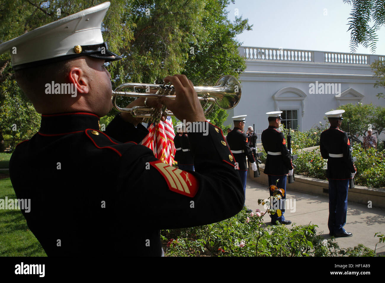 Sergeant John T. Finch, a trumpet player serving with the 1st Marine Division Band, plays taps to honor those who fought and died during the Vietnam War at the Richard Nixon Presidential Library and Museum for the Vietnam Prisoner of War 40th Annual Homecoming Reunion here, May 23, 2013. Nearly 200 former Vietnam POWs and their families gathered at the Nixon Presidential Library on the 40th anniversary of when President Nixon hosted the service members for the largest dinner ever held at the White House, May 24, 1973, on the South Lawn. A seven-man rifle detail and color guard from 1st Reconna Stock Photo
