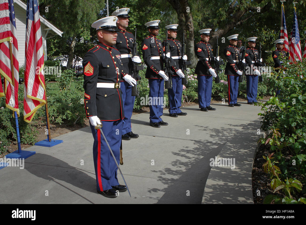 Sergeant Casimiro Zarate, a Bunkerville, Nev., native serving with 1st Reconnaissance Battalion, leads a seven-man rifle detail in a salute during the playing of 'Taps' at the Richard Nixon Presidential Library and Museum for the Vietnam Prisoner of War 40th Annual Homecoming Reunion here, May 23, 2013. Nearly 200 former Vietnam POWs and their families gathered at the Nixon Presidential Library on the 40th anniversary of when President Nixon hosted the service members for the largest dinner ever held at the White House, May 24, 1973, on the South Lawn. 1st Marine Division honors 40th Annual Vi Stock Photo