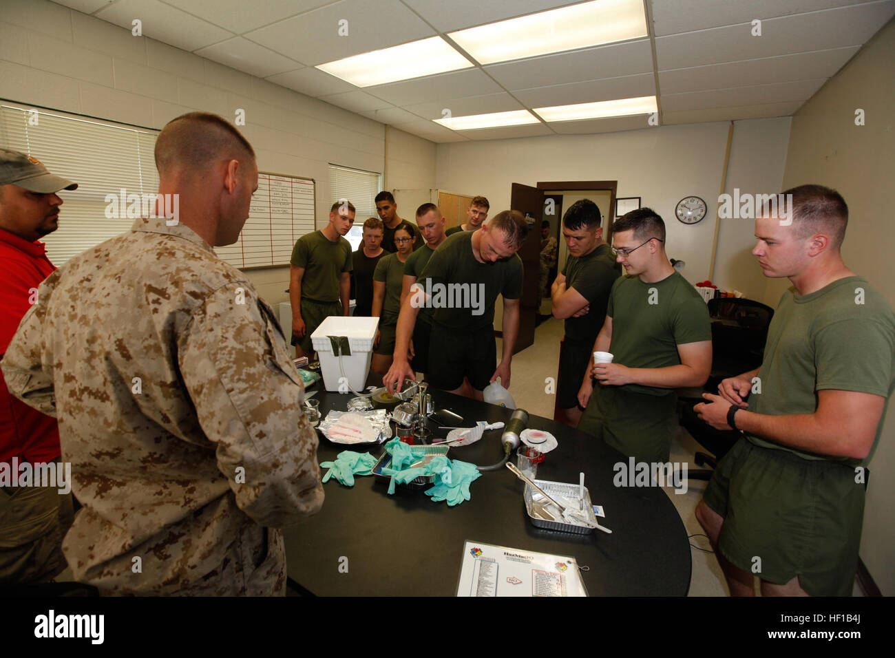 Master Sgt. Tony Nesbit, the chemical, biological, radiological and nuclear defense staff noncommissioned officer in charge, gave Marines who conducted a mock terrorist laboratory training see the site without the Class 2 ensembles. CBRN Marines respond to chemical warfare threat 130614-M-FL266-001 Stock Photo