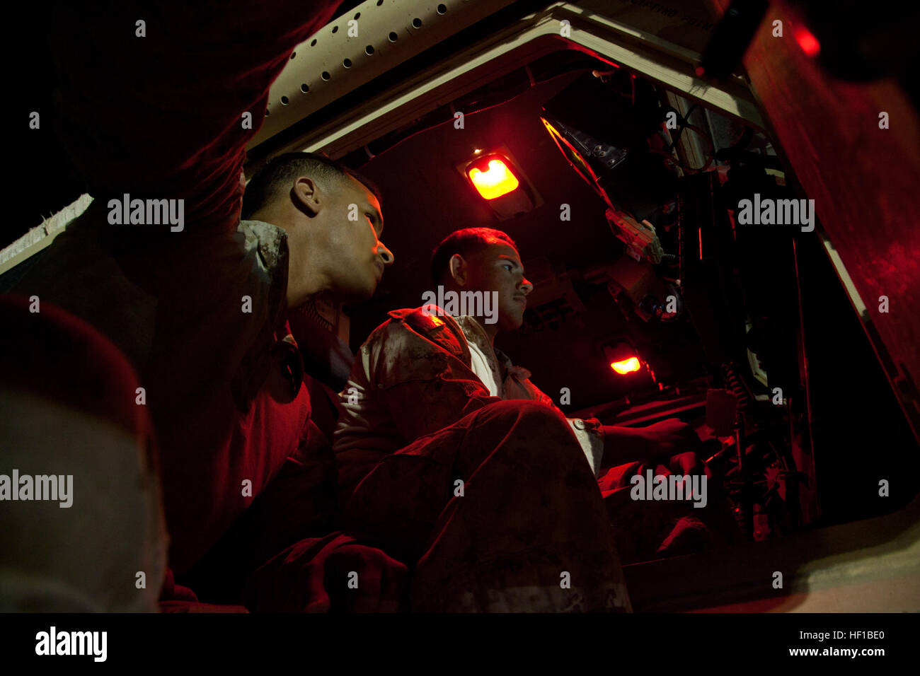 U.S. Marine Corps Staff Sgt. Brian K. Landrum, left, and Cpl. Ramon Mejia, from Atlanta, Ga. and Los Angeles, Calif., respectively, and both assigned to Georgian Liaison Team-9 prepare their vehicle before conducting Operation Northern Lion on Camp Leatherneck, Helmand province, Afghanistan, June 24, 2013. Northern Lion was a Georgian-led operation conducted to deter insurgents, establish a security presence, and gather human intelligence in the area. (U.S. Marine Corps photo by Cpl. Alejandro Pena/Released) Coalition Forces prepare for Operation Northern Lion 02 Stock Photo