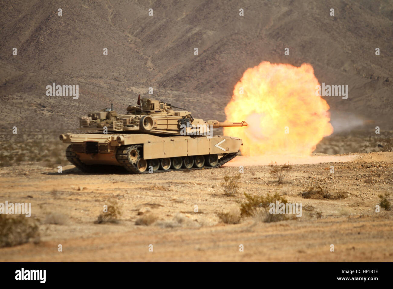 An M1A1 main battle tank manned by Australian Army soldiers engage a ...