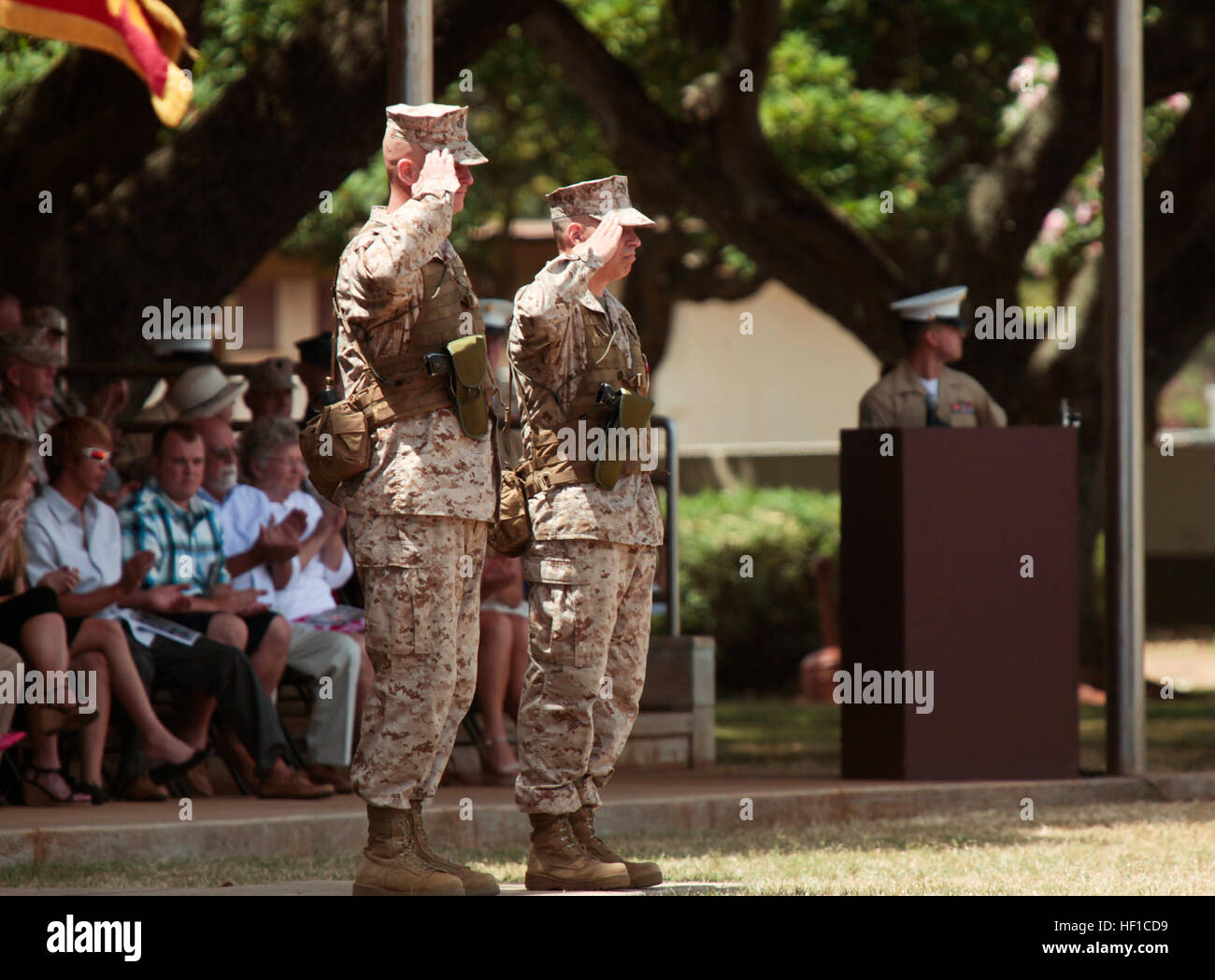 U.S. Marine Corps Colonel Timothy E. Winand, Commanding Officer of Third Marine Regiment, and Colonel Nathan I. Nastase, former Commanding Officer of 3rd Marine Regiment, render a salute as the pass and review goes on during 3rd Marine Regiment's change of command ceremony at Dewey Square, Marine Corps Base Hawaii, Kaneohe Bay on July 17th, 2013. The ceremony marked the passing of command between Colonel Nastase and Colonel Winand. (U.S. Marine Corps photo by Private 1st Class Roberto Villa Jr./Released) Third Marine Regiment Change of Command 130717-M-BN443-053 Stock Photo