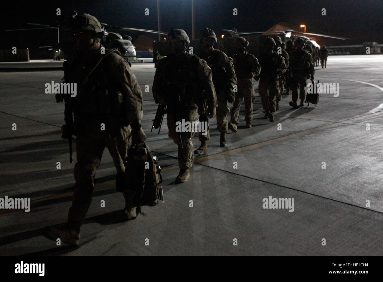 U.S. Marines with Golf Company, 2nd Battalion, 8th Marines, walk on the ...