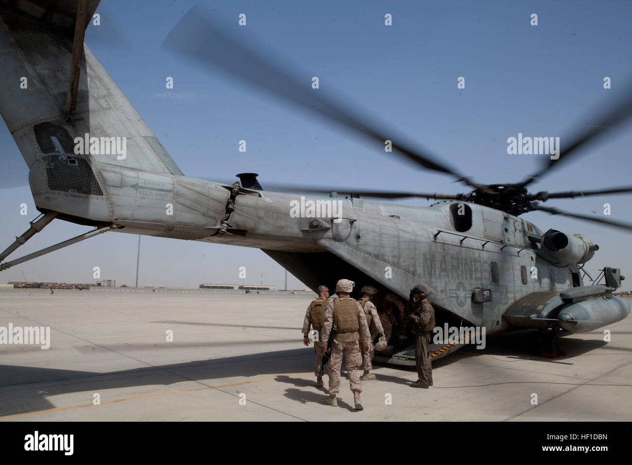 Military staff with the International Security Assistance Force and Regional Command (Southwest) board a U.S. Marine Corps CH-53E Super Stallion helicopter at Camp Bastion in Helmand province, Afghanistan, July 29, 2013. U.S. Marine Corps Gen. Joseph F. Dunford, the commanding general of the International Security Assistance Force, and accompanying staff were en route to Main Operating Base Lashkar Gah to discuss various issues and meet with the governor of Helmand province. (DoD photo by Sgt. Tammy K. Hineline, U.S. Marine Corps/Released) CH-53E Super Stallion helicopter, Camp Bastion in Helm Stock Photo