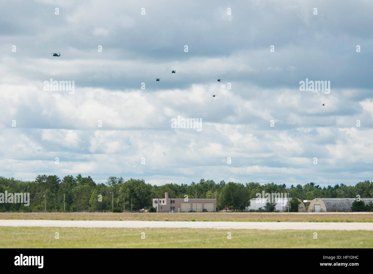 UH-60M Black Hawks from the 3-238th General Support Aviation Battalion from Grand Ledge, Mich., land at Grayling Airfield, Grayling, Mich., Aug. 3, 2013. The 3-238th is participating in Exercise Northern Strike 2013, a joint multinational combined arms training exercise conducted in Michigan. (U.S. Air National Guard photo by Master Sgt. Scott Thompson/released) U.S. Army UH-60M Black Hawk helicopters assigned to the 3rd Battalion, 238th Aviation Regiment prepares to land at Grayling Airfield in Grayling, Mich., Aug. 3, 2013, during Northern Strike 130803-Z-GS745-004 Stock Photo