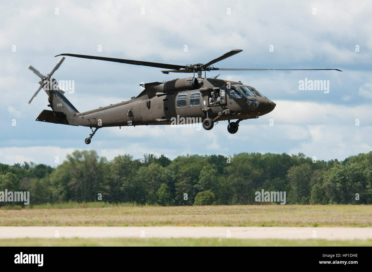 UH-60M Black Hawks from the 3-238th General Support Aviation Battalion from Grand Ledge, Mich., land at Grayling Airfield, Grayling, Mich., Aug. 3, 2013. The 3-238th is participating in Exercise Northern Strike 2013, a joint multinational combined arms training exercise conducted in Michigan. (U.S. Air National Guard photo by Master Sgt. Scott Thompson/released) A U.S. Army UH-60M Black Hawk helicopter assigned to the 3rd Battalion, 238th Aviation Regiment prepares to land at Grayling Airfield in Grayling, Mich., Aug. 3, 2013, during Northern Strike 130803-Z-GS745-033 Stock Photo