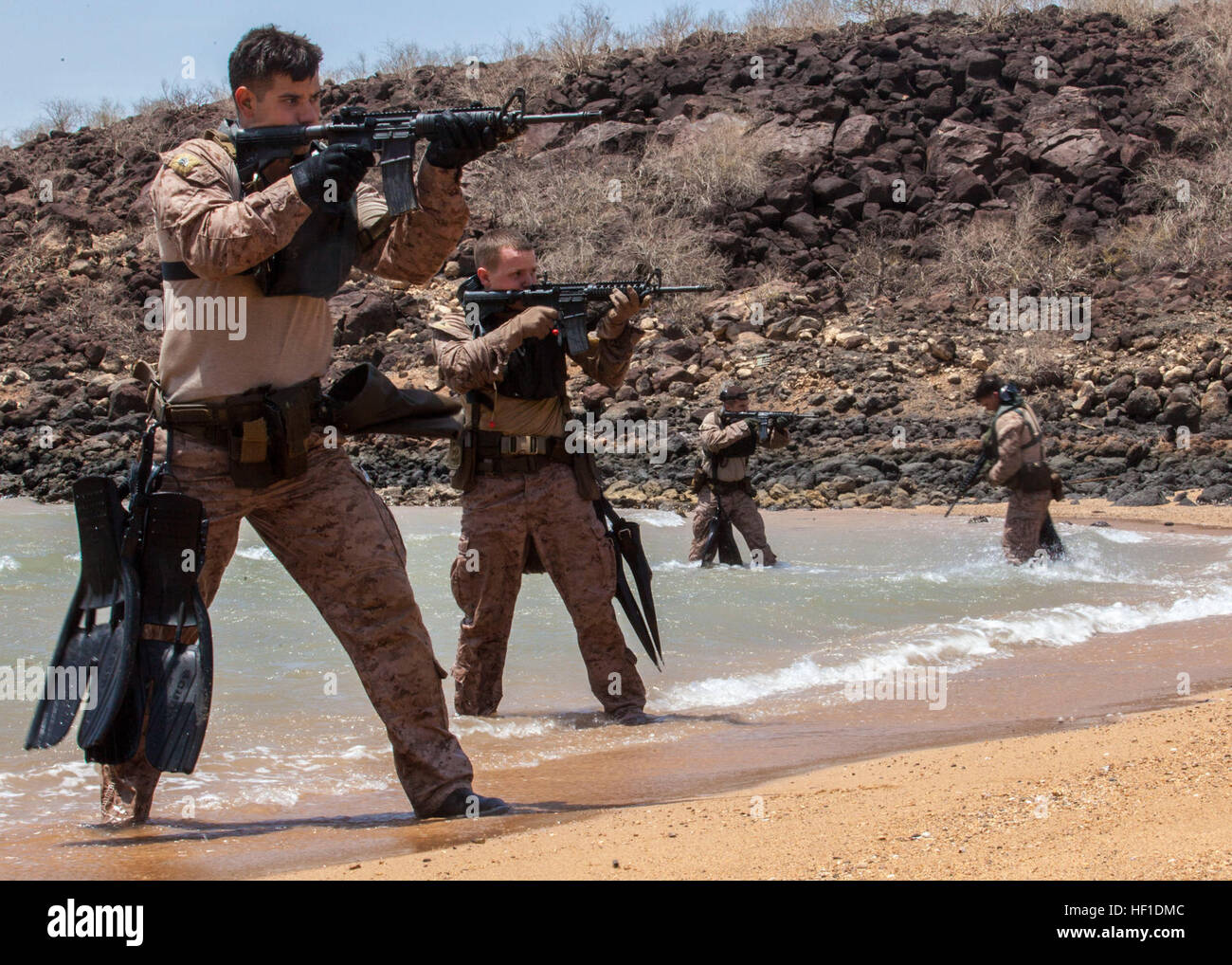 U.S. Marines with the 26th Marine Expeditionary Unit's maritime raid force engage simulated hostile targets during an amphibious insertion as part of sustainment training at an undisclosed location in the U.S. 6th Fleet area of responsibility Aug. 5, 2013. (DoD photo by Sgt. Christopher Q. Stone, U.S. Marine Corps/Released) 130805-M-SO289-015 (9524187552) Stock Photo