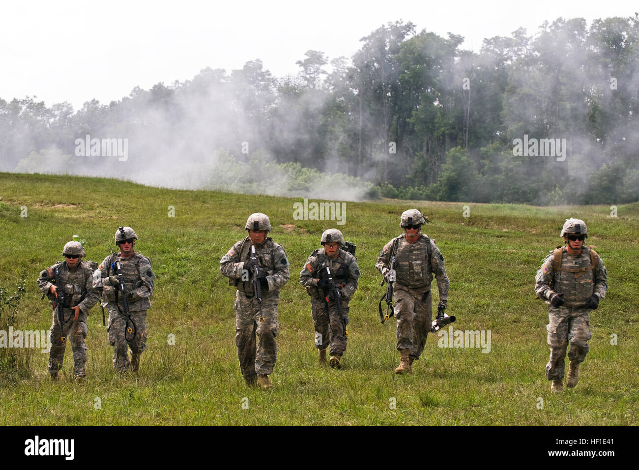 Ohio National Guard Soldiers of 2nd Squadron, 107th Cavalry Regiment,  headquartered in Hamilton, Ohio, fall back under the concealment of smoke  during a combined-arms exercise held at the Infantry Squad Battle Course, image size:1300x956