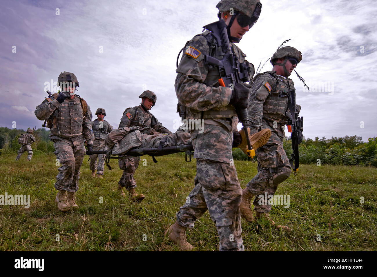 Ohio National Guard soldiers of 2nd Squadron, 107th Cavalry Regiment,  headquartered in Hamilton, Ohio, litter carry a simulated wounded soldier  during a combined-arms exercise held at the Infantry Squad Battle Course at, image size:1300x956