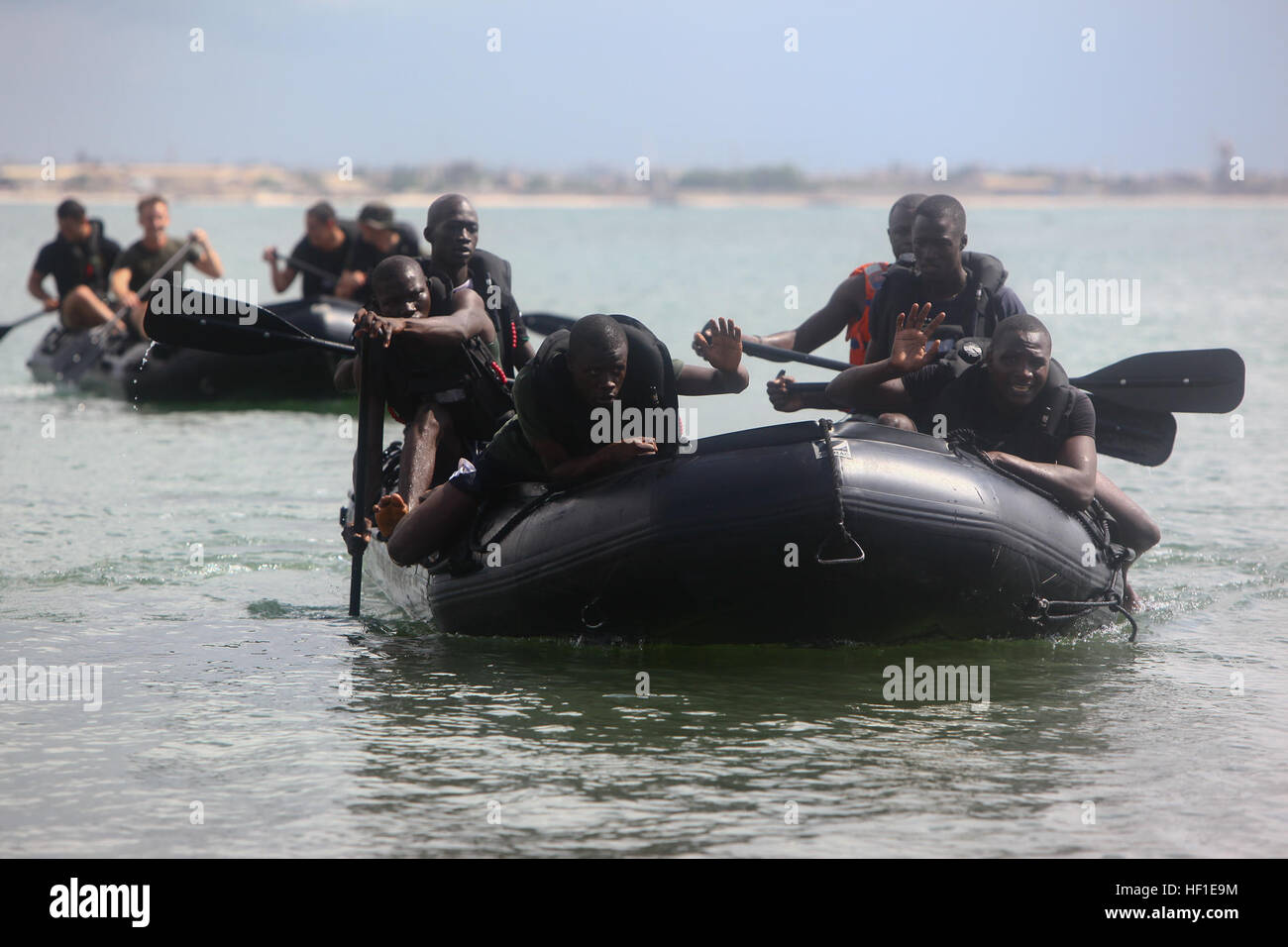 Senegalese Companie de Fusilier Marine Commandos apply basic boating skills taught by Marines and sailors of Special-Purpose Marine Air-Ground Task Force 13 on Bel Air Naval Base in Dakar, Senegal, Aug. 13, 2013. Special-Purpose MAGTF Africa strengthens U.S. Marine Corps Forces Africa and U.S. Africa Command's ability to assist partner nations in theater security cooperation and military-to-military engagements. Special-Purpose MAGTF Africa's current iteration is the fourth rotation working with the Senegalese Forces. (U.S. Marine Corps photo by Cpl. Ryan Joyner/Released) Special-Purpose Marin Stock Photo