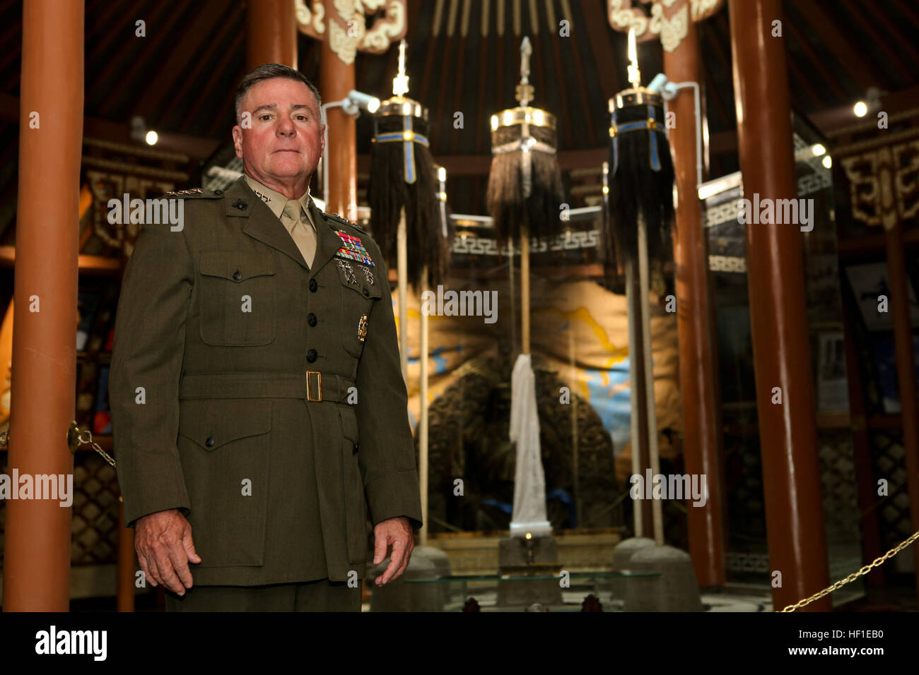 U.S. Marine Lt. Gen. Terry G. Robling, Commander, U.S. Marine Corps Forces, Pacific stands in front of the  Mongolian Black Banners from the era of Chinggis Khaan at the Ministry of Defense in Ulaanbaatar, Mongolia on Aug. 15, 2013. Khaan Quest is an annual multinational exercise sponsored by the U.S. and Mongolia, and it is designed to strengthen the capabilities of U.S., Mongolian and other nations' forces in international peace support operations. (U.S. Marine Corps photo by Cpl. Robert Bush) US Marine Lt Gen Terry G Robling Commander US Marine Corps Forces Pacific stands in front of the Mo Stock Photo