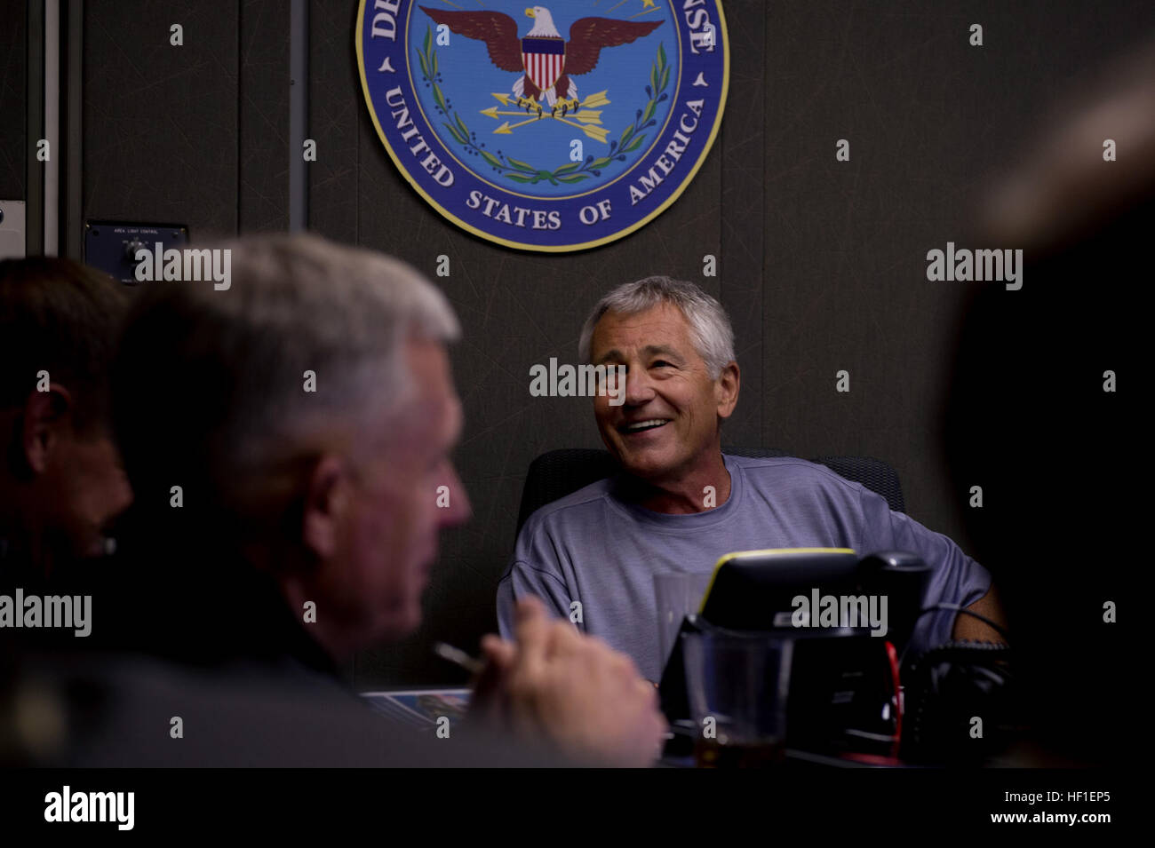 Secretary of Defense Chuck Hagel meets with his staff before a press briefing aboard a plane en route to Malaysia Aug. 23, 2013. Hagel was on a nine-day trip to meet with defense leaders in Malaysia, Indonesia, Brunei and the Philippines. (DoD photo by Sgt. Aaron Hostutler, U.S. Marine Corps/Released) Secretary of Defense 130823-M-EV637-059 Stock Photo