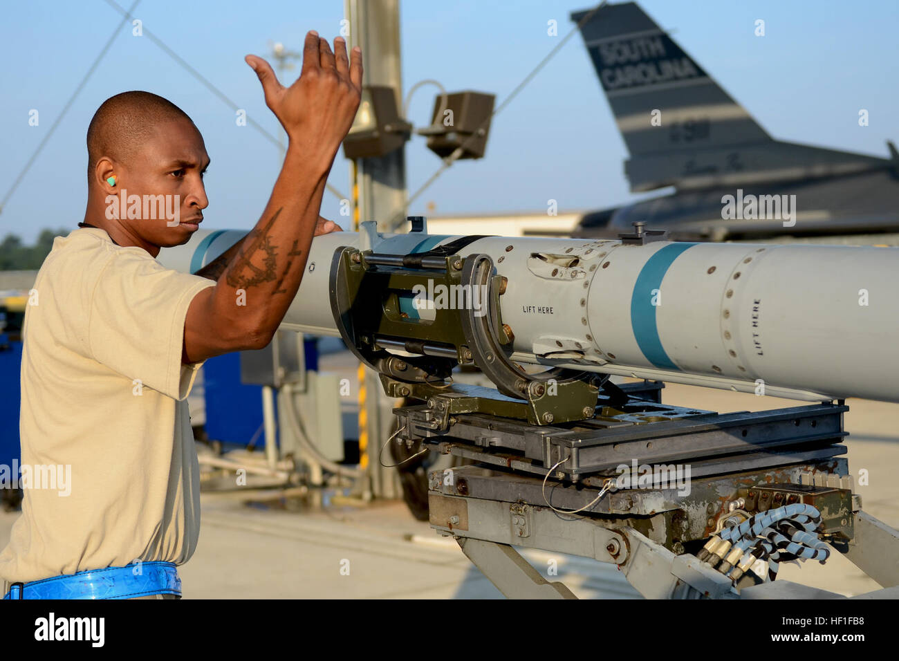 U.S. Air Force weapons loaders with the 169th Aircraft Maintenance ...