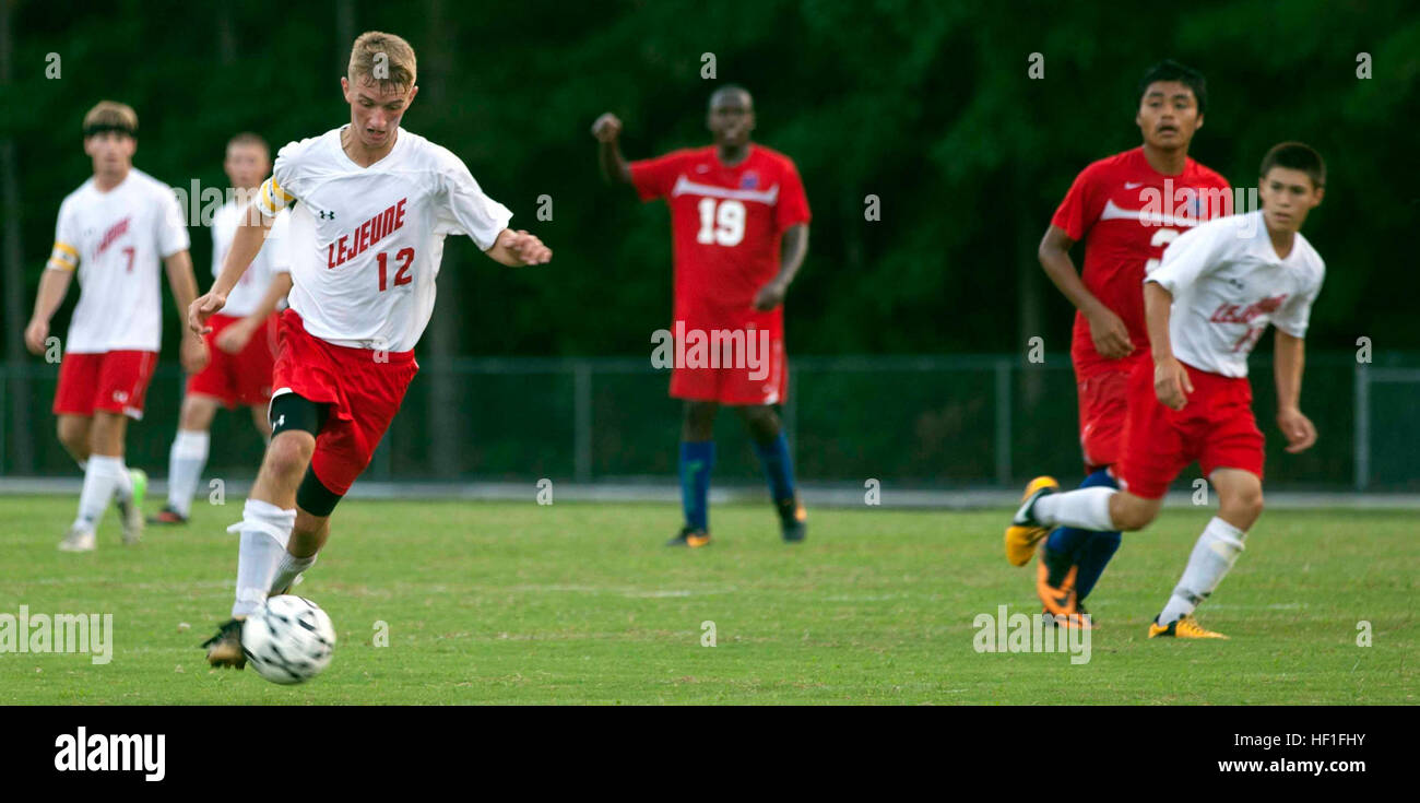 James Osborne, junior soccer player for Lejeune Devilpups, dribbles
