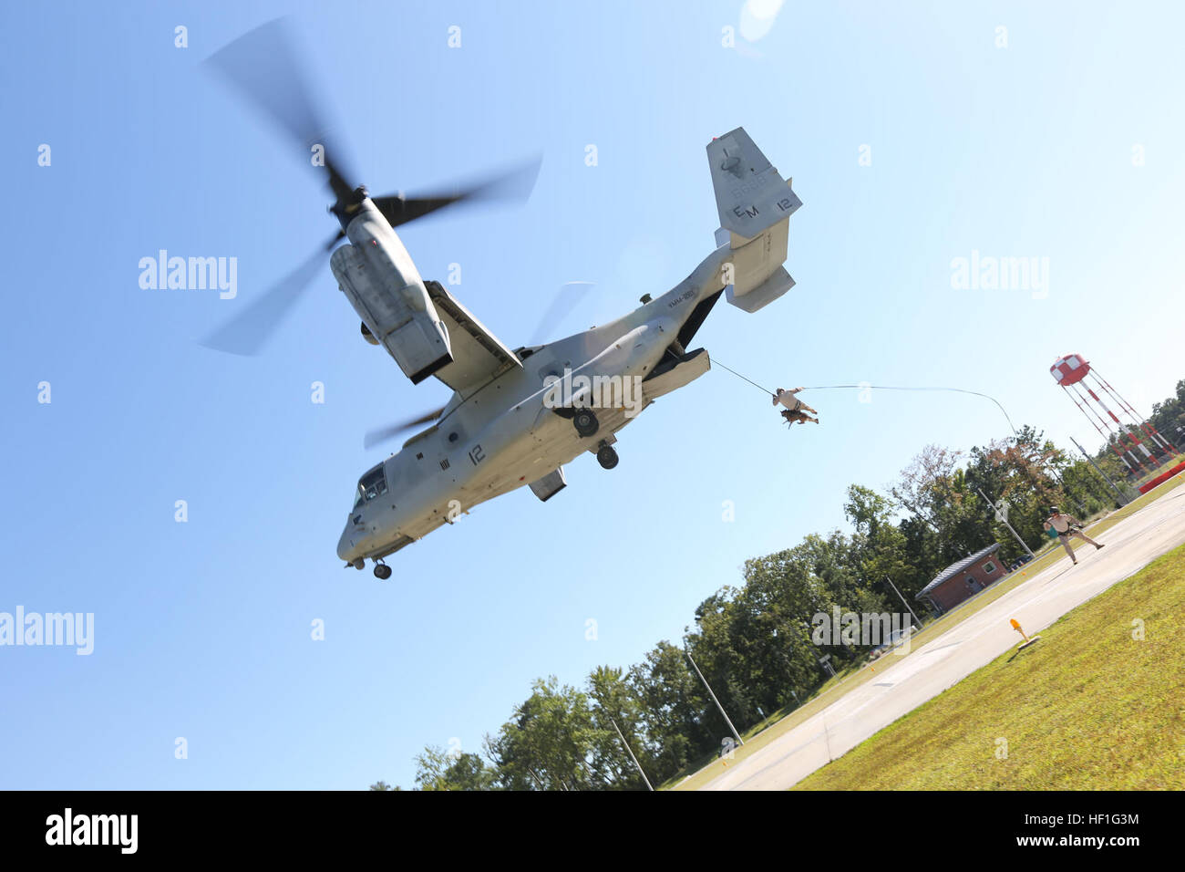A Marine Multipurpose Canine handler and dog fast-roped from an MV-22 ...
