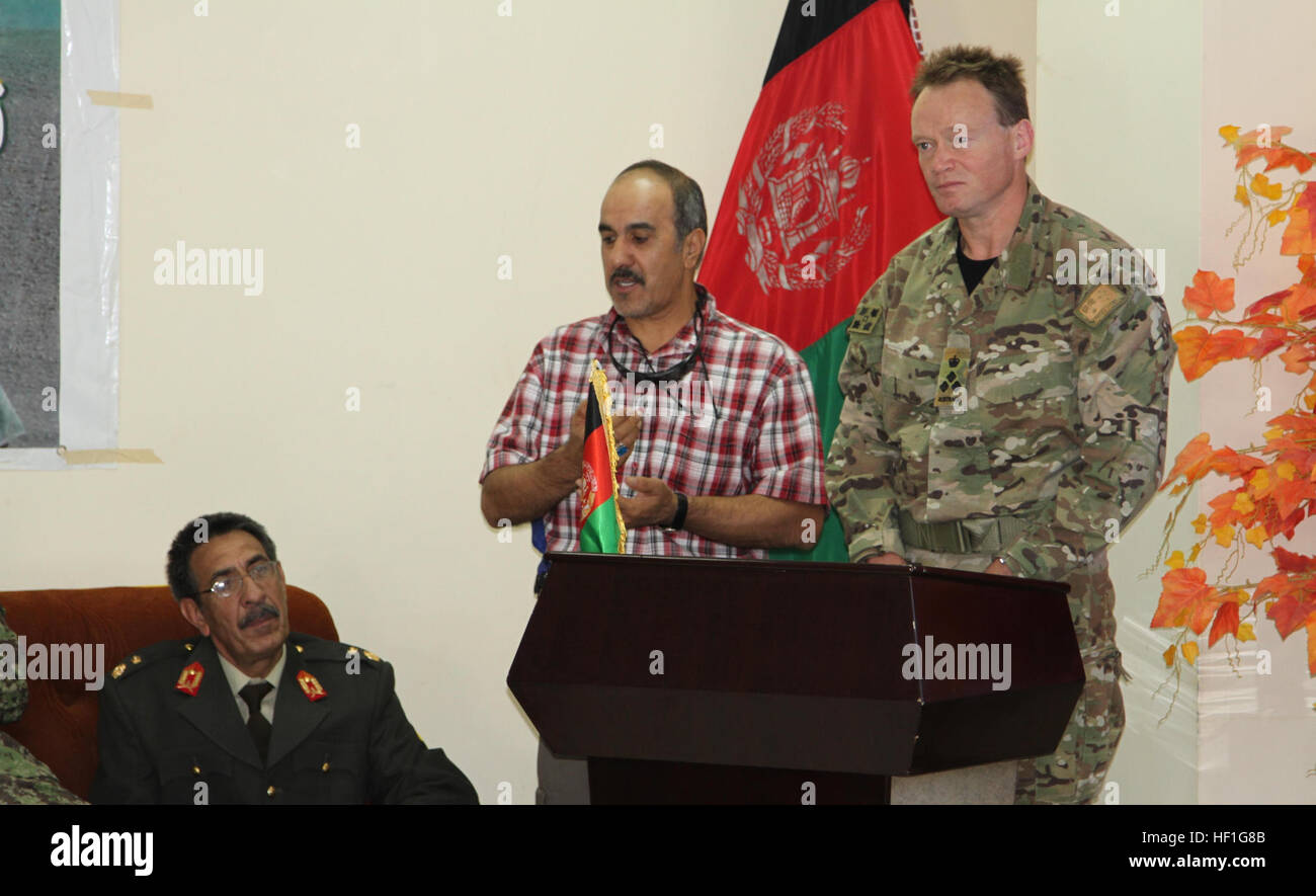 Australian Brig. Gen. Patrick Kidd, Regional Command (South) deputy commanding general for force development, speaks at the ribbon cutting ceremony held at Kandahar Regional Military Hospital at Camp Hero, Afghanistan, Sept. 25, 2013. The KRMH had spent the last decade working with coalition forces to provide a sufficient military hospital for the Afghan National Army as well as civilians in Kandahar province. (U.S. Army photo by Cpl. Clay Beyersdorfer) Afghans take lead with local hospital 130925-Z-HP669-373 Stock Photo
