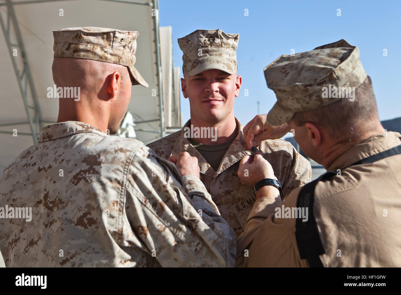 Sgt. Martin A. Witman, center, a combat crewman with Marine Transport ...