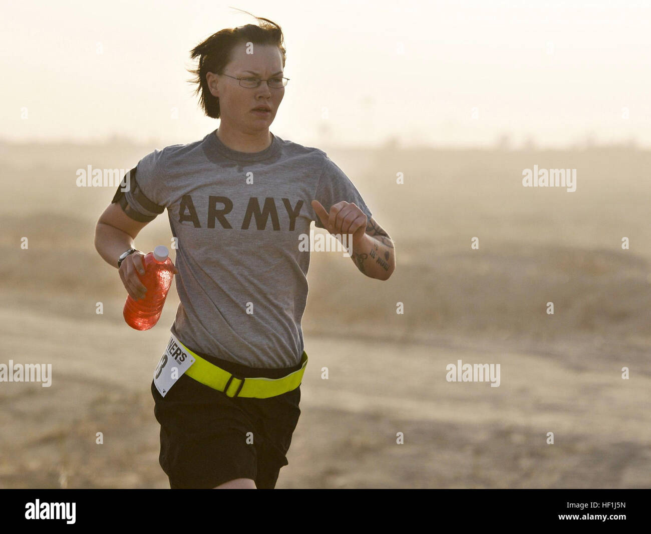 U.S. Army Cpl. Bevin Cook, 272nd Military Police Company, U.S. Division-North, runs the Task Force 26.2 Half Marathon at Contingency Operating Base Speicher, Iraq, April 17. Cook, from Royal Oak, Mich., took first place for the female division. Flickr - DVIDSHUB - Half, full marathon cap off Task Force 26.2 run series (Image 7 of 7) Stock Photo