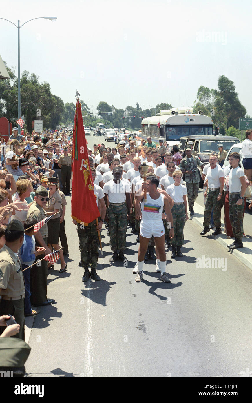 Warrant Officer Ralph Ramos of School Battalion leads a platoon as he carries the Olympic flame across the base on its way to the 23rd Olympic Games in Los Angeles. 1984 Summer Olympics torch relay 1984-07-25 3 Stock Photo