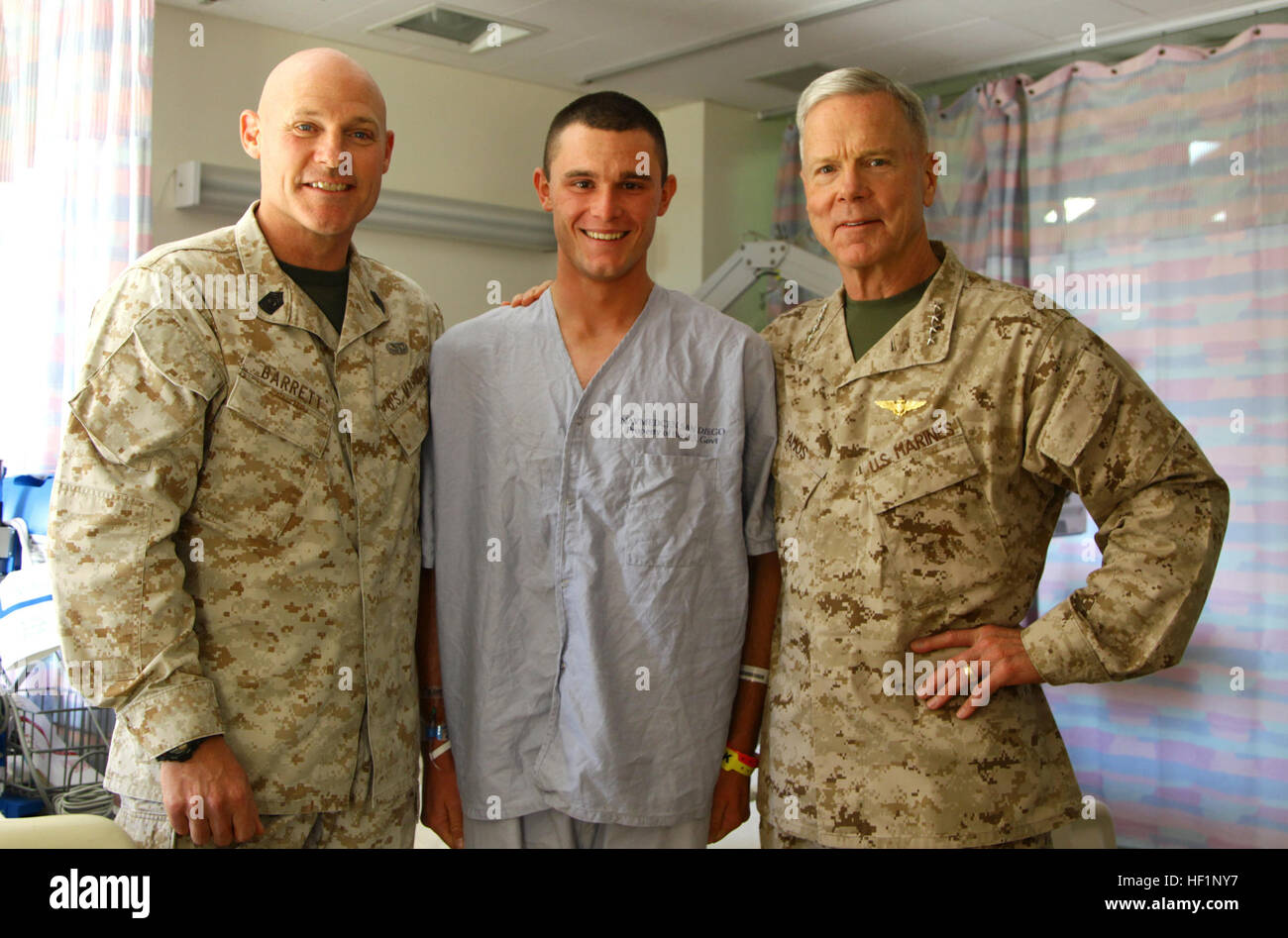 The 35th commandant of the Marine Corps, General James F. Amos, the 17th sergeant major of the Marine Corps, Sgt. Maj. Micheal P. Barrett and Mrs. Bonnie Amos, visit wounded warriors and patients at Balboa Hospital, Naval Medical Center San Diego, Calif., Oct. 19, 2013. (U.S. Marine Corps photo by Sgt. Keonaona C. Paulo, 3rd MAW Combat Camera/Released) CMC visits Wounded Warriors at Balboa Hospital 131019-M-EF955-071 Stock Photo