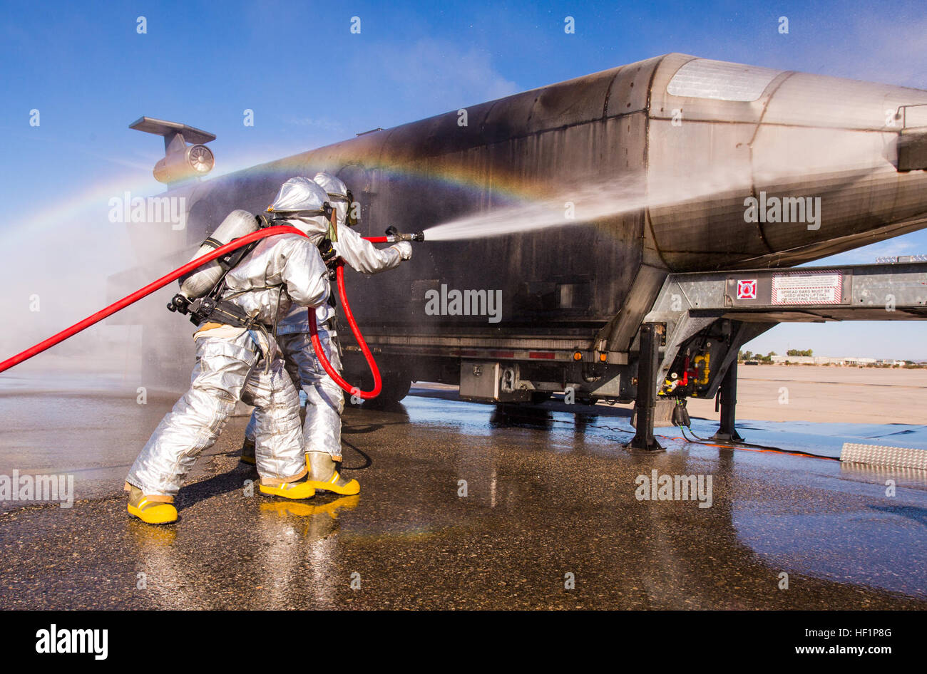 Aircraft Rescue and Firefighting Marines tactfully dispose of impeding