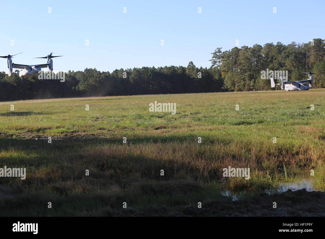 Two MV22 Ospreys land on a landing zone near the Military Operations