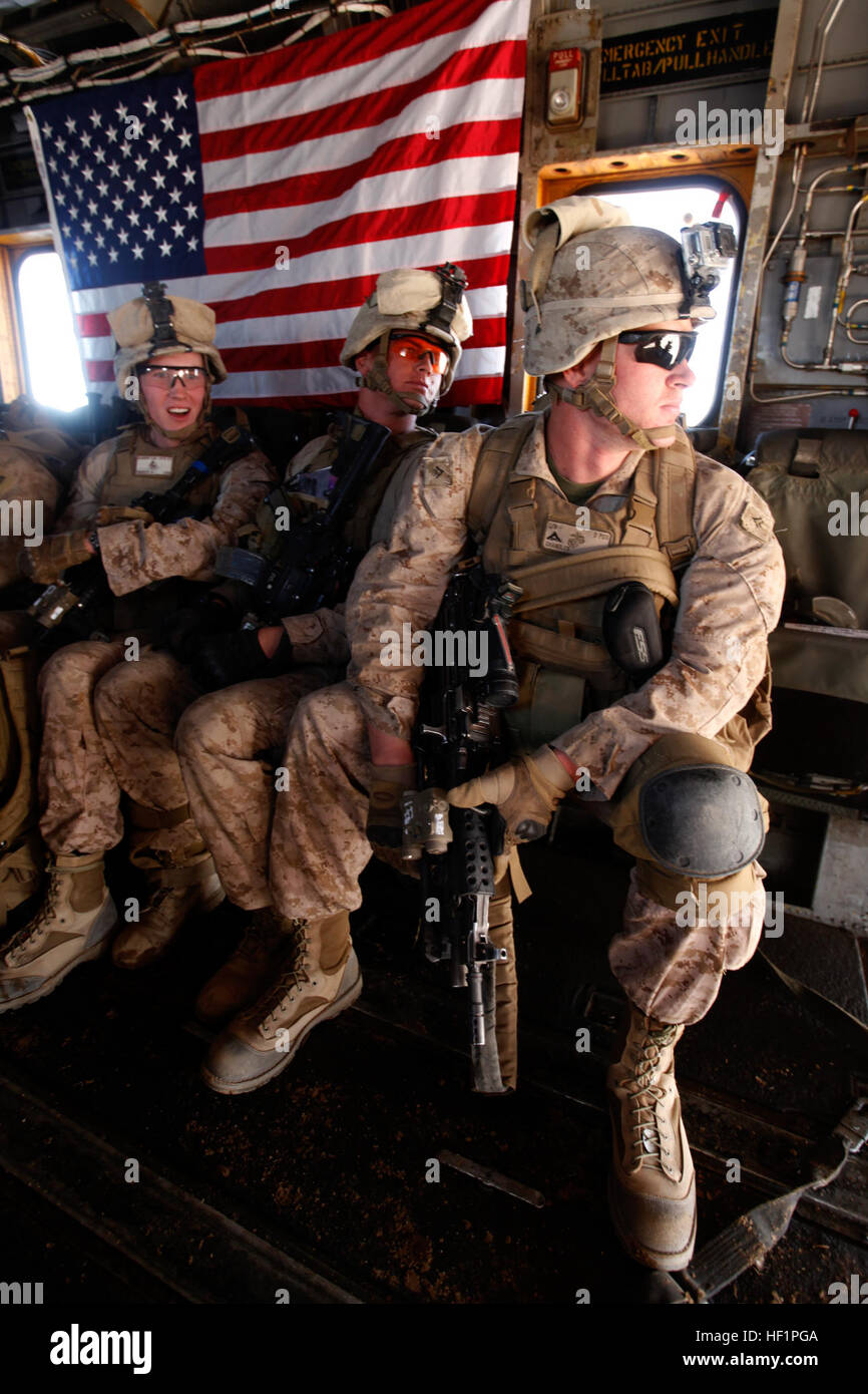 U.S. Marines with Bravo Company, 1st Battalion, 9th Marine Regiment (1/9), wait inside a CH-53E Super Stallion assigned to Marine Heavy Helicopter Squadron 462 (HMH-462) over Helmand province, Afghanistan, Oct. 28, 2013. HMH-462 provided aerial support for 1/9 during an interdiction operation in Gurjat Village. (Official Marine Corps Photo by Sgt. Gabriela Garcia/Released) HMH-462 Operation with 1-9 in Gurjat Village 131028-M-SA716-112 Stock Photo