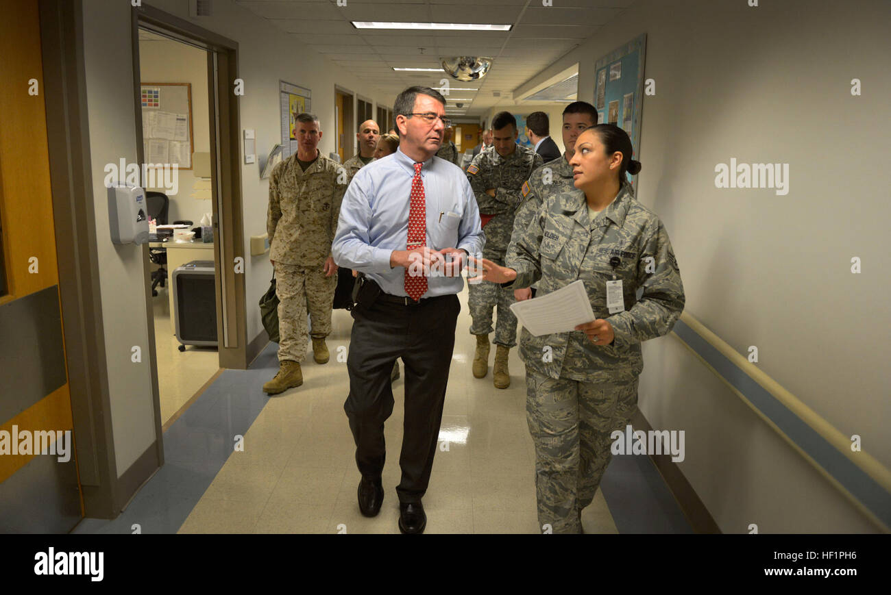U.S. Air Force Staff Sgt. Teresa Moldes, right, escorts Deputy Secretary of Defense Ash Carter down a corridor at Brooke Army Medical Center in San Antonio Oct. 29, 2013. Carter visited wounded U.S. service members at the hospital and presented Purple Hearts to five soldiers. (DOD photo by Glenn Fawcett/Released) Deputy secretary of defense visits wounded warriors, awards Purple Hearts 131029-D-NI589-198 Stock Photo
