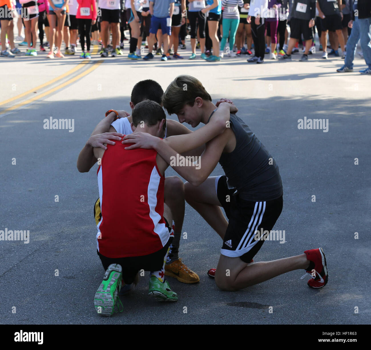 Members of the Swansboro High School Cross Country team share words of