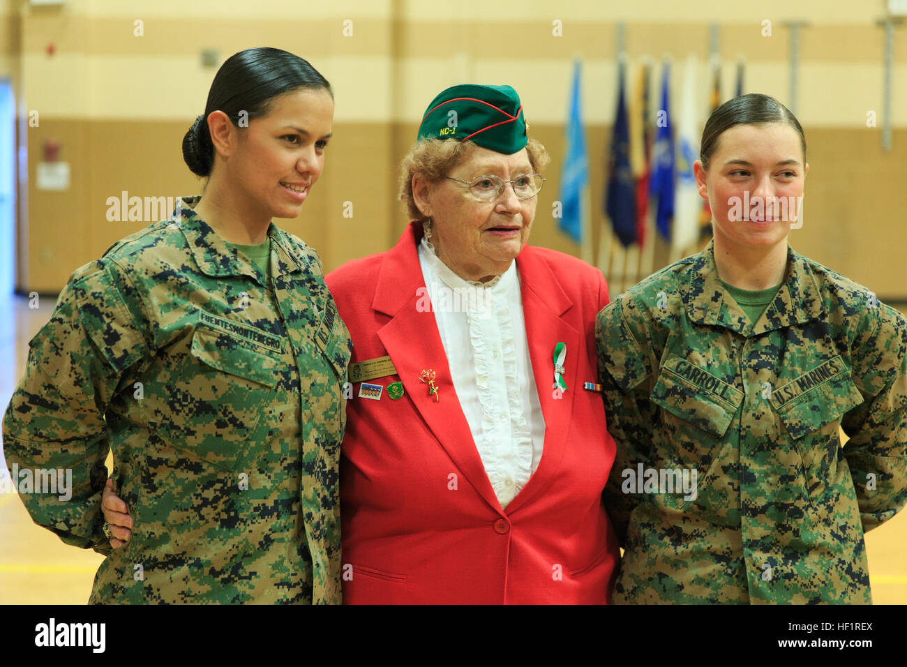 Pfc. Cristina Fuentes Montenegro, 25, one of the first three female Marine graduates from the School of Infantry-East's Infantry Training Battalion course, and native of Coral Springs, Florida, left, and Pfc. Julia Carroll, 18, one of the first three female Marine graduates from the School of Infantry-East's Infantry Training Battalion course, and native of Idaho Falls, Idaho, far right, stand with Shirley M. John from the North Carolina Tarheel Chapter of the Women Marines Association following the graduation ceremony of Delta Company, Infantry Training Battalion, School of Infantry-East at C Stock Photo