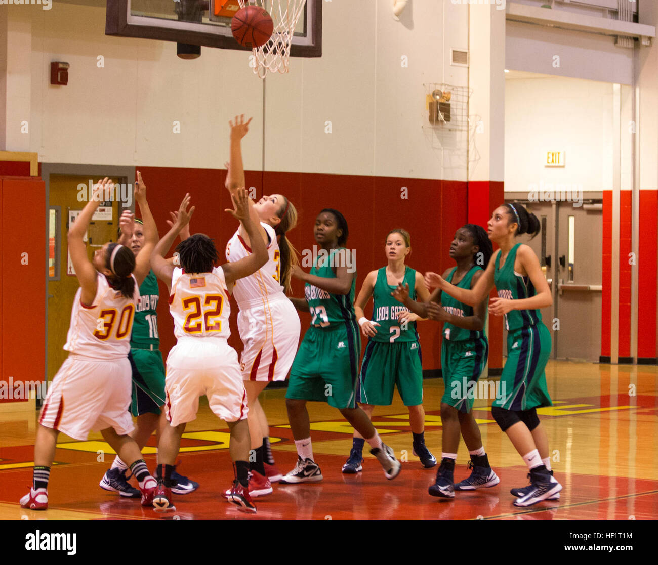 Lejeune High School' Devilpups reach for a rebound during a girls