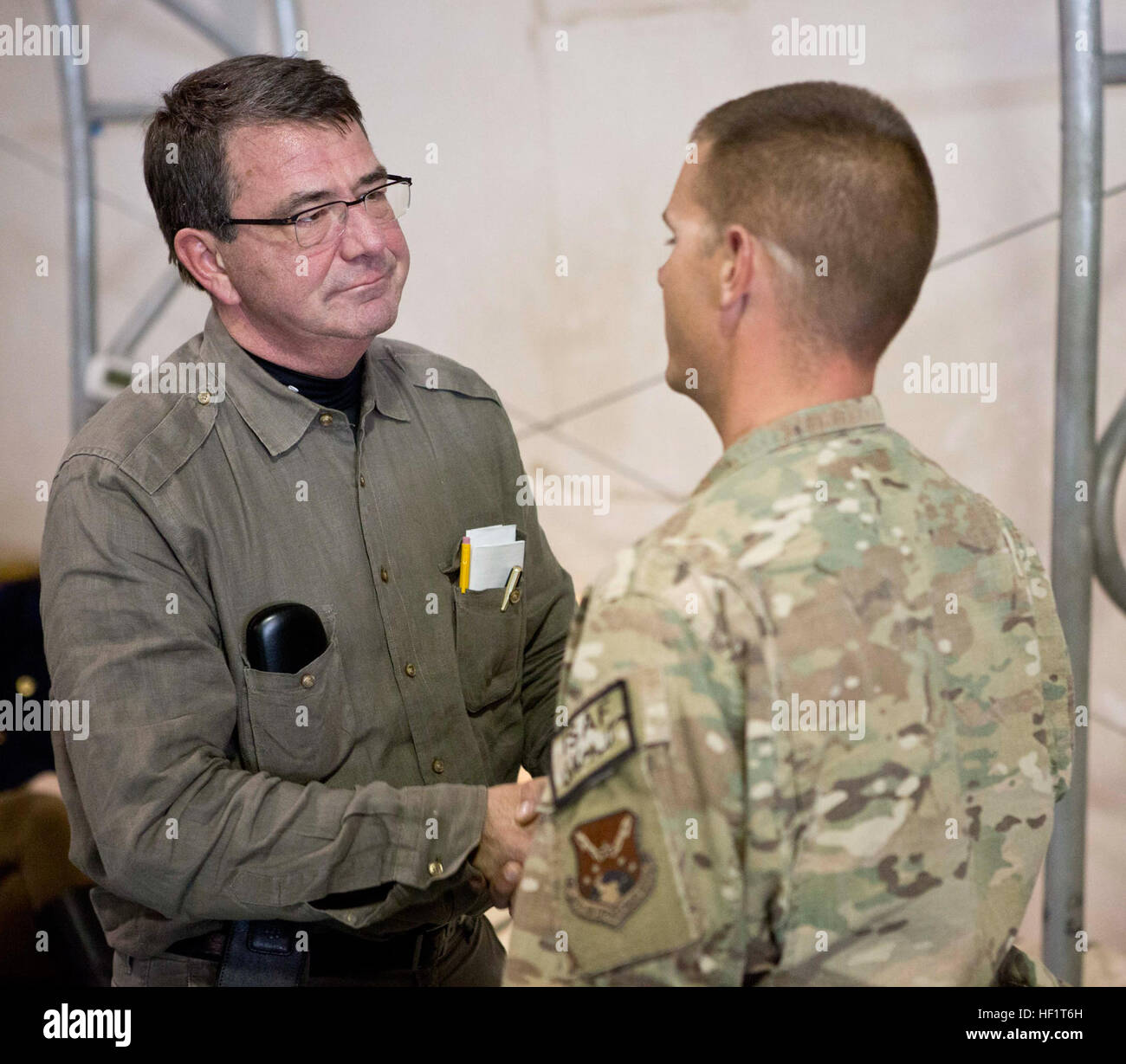 U.S. Deputy Secretary of Defense Ashton Carter, shakes the hands of service members with Regional Command (Southwest) at Camp Leatherneck, Helmand province, Afghanistan, Nov. 29, 2013. Carter came to speak to military leaders and coaltion forces with RC(SW). (Official Marine Corps Photo by Cpl. Nicholas T. Nohalty/Released) U.S. Deputy Secretary of Defense Ash Carter, left, greets a Service member with Regional Command (Southwest) at Camp Leatherneck, Helmand province, Afghanistan, Nov. 29, 2013 131129-M-FN127-018 Stock Photo