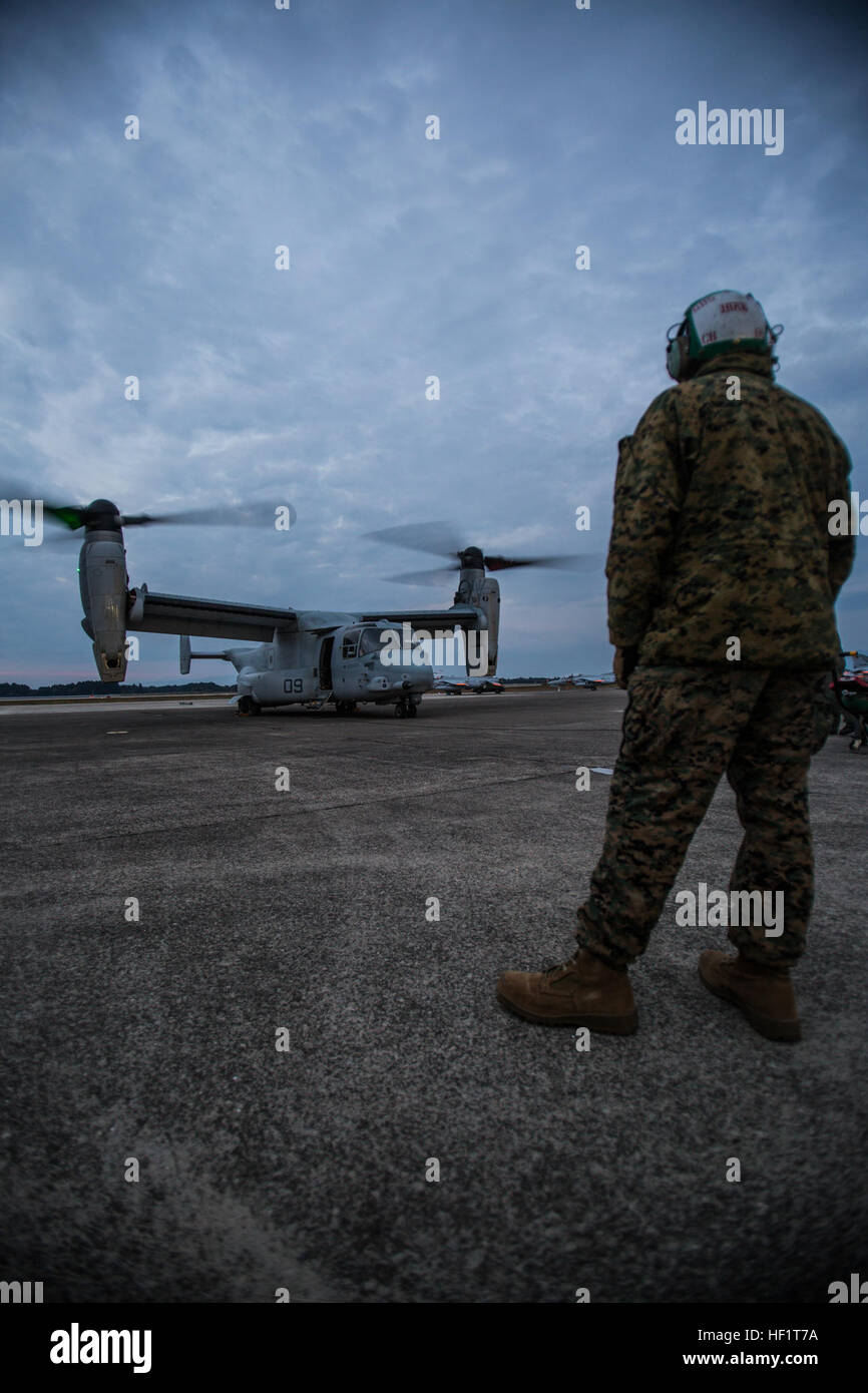 Marines from Marine Medium Tiltrotor Squadron 265, an MV-22 Osprey squadron stationed at Marine Corps Air Station Futenma, Okinawa, Japan, attended the Japan Air Self-Defense Force Nyutabaru Air Base Air Show, Dec. 1, 2013. The air show was the first public display of an Osprey in Mainland Japan. Prior to the air show, VMM-265 hosted a media relations event Nov. 30, aboard the JASDF installation.  The air show is an annual event hosted by the JASDF in Miyazaki, Miyazaki Prefecture. (Official Marine Corps photo by Cpl. Benjamin Pryer/Released) First public display of Osprey in mainland Japan 13 Stock Photo