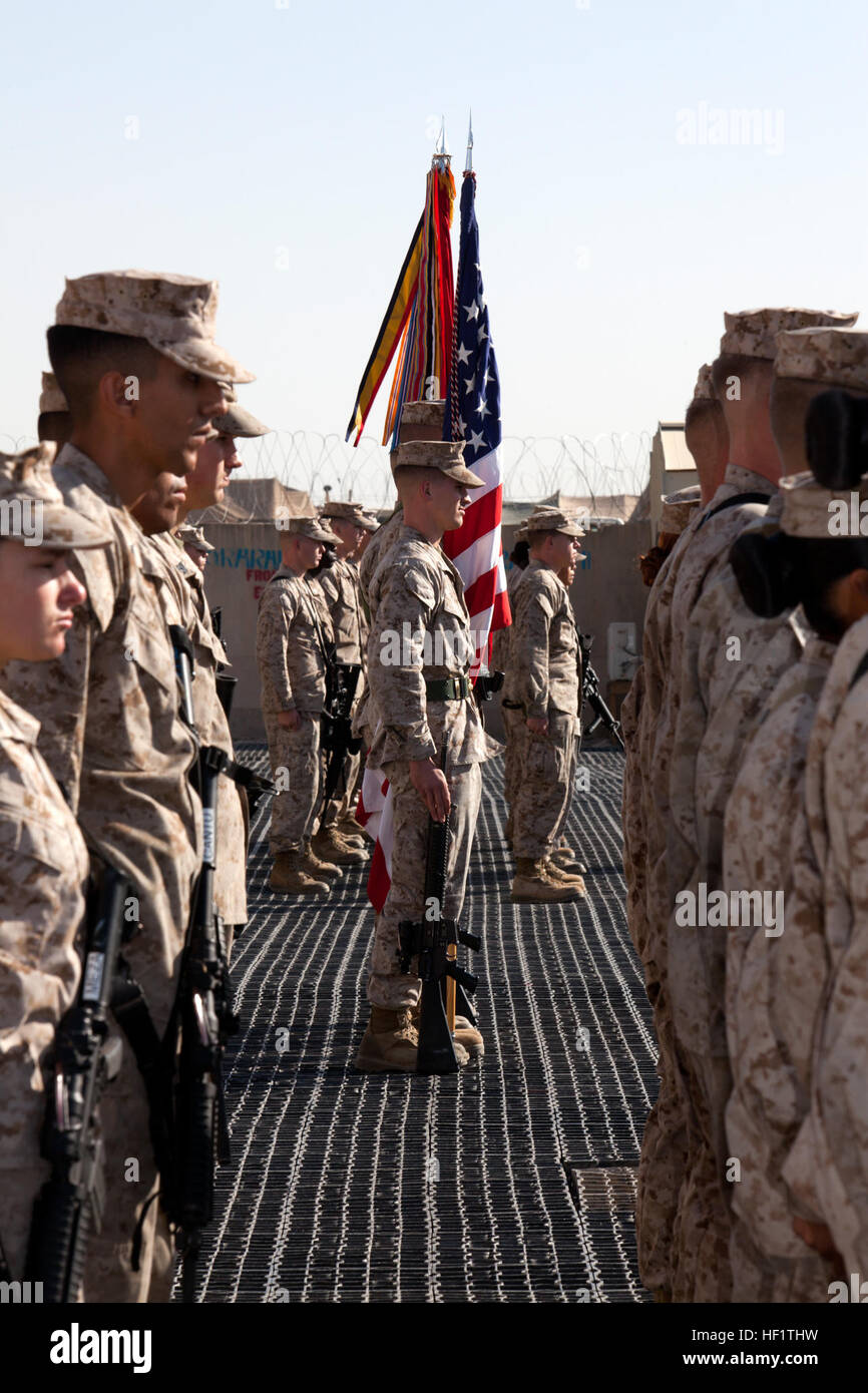 U.S. Marines with 2nd Marine Aircraft Wing Forward (2nd MAW (FWD)) participate in a change of command ceremony at Camp Leatherneck, Helmand province, Afghanistan, Dec. 9, 2013. Brig. Gen. Gary L. Thomas relinquished command as the commanding general of 2nd MAW (FWD) to Col. Scott S. Jensen as commanding officer. (U.S. Marine Corps photo by Sgt. Gabriela Garcia/Released) 2nd MAW (FWD) Change of Command Ceremony 131209-M-SA716-021 Stock Photo