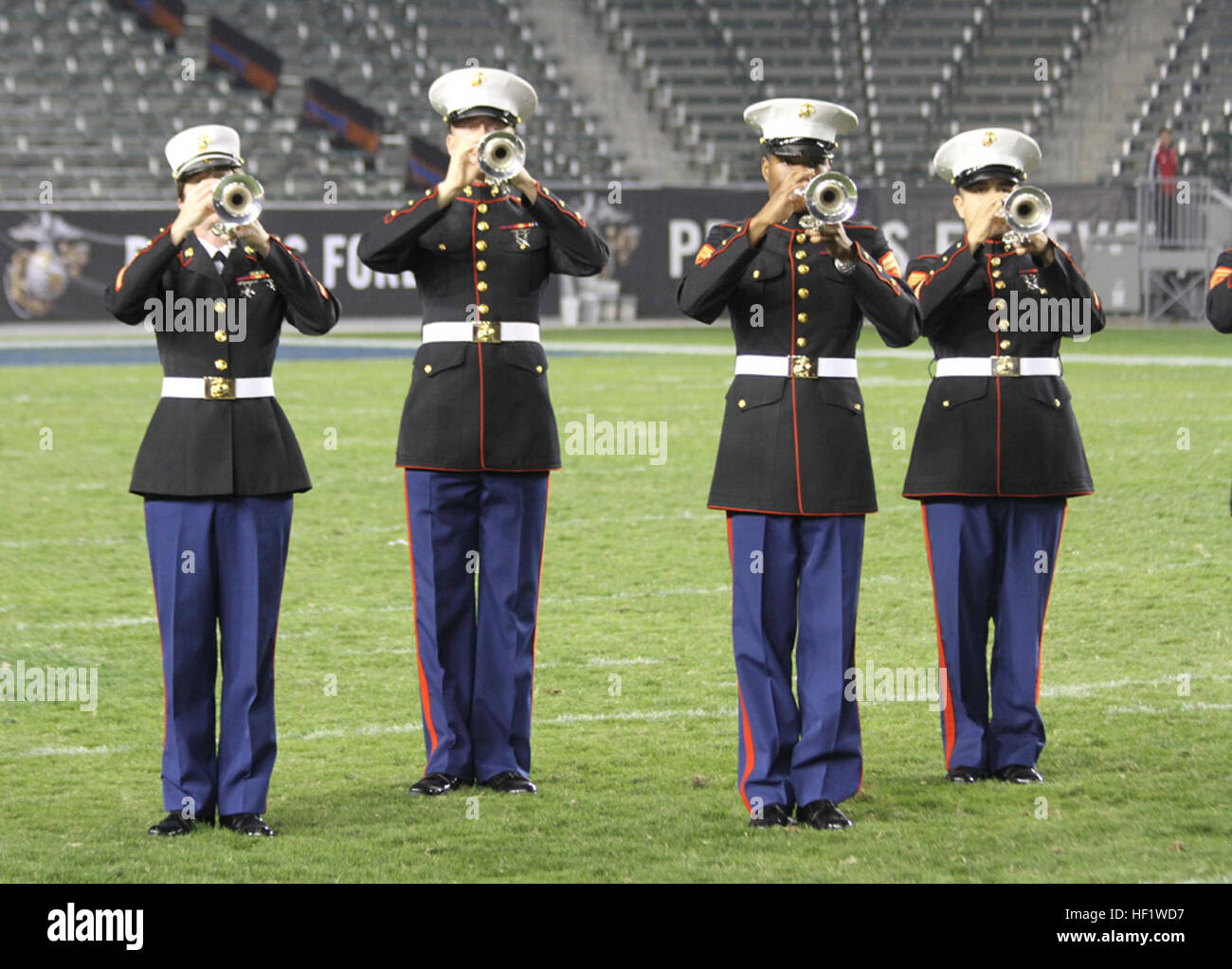 Marines with Marine Band San Diego play the National Anthem during the Semper Fidelis All-American Bowl at The StubHub Center in Carson, Calif., Jan. 5, 2014. The Semper Fidelis Football Program brought together over 90 of the best high-school football players in an East versus West game and is an opportunity for the Marine Corps to connect on a personal and local level with players and influencers, demonstrates commitment to developing quality citizens, and reinforces how core values of honor, courage and commitment relate to success on and off the field. (Official U.S. Marine Corps photo by  Stock Photo